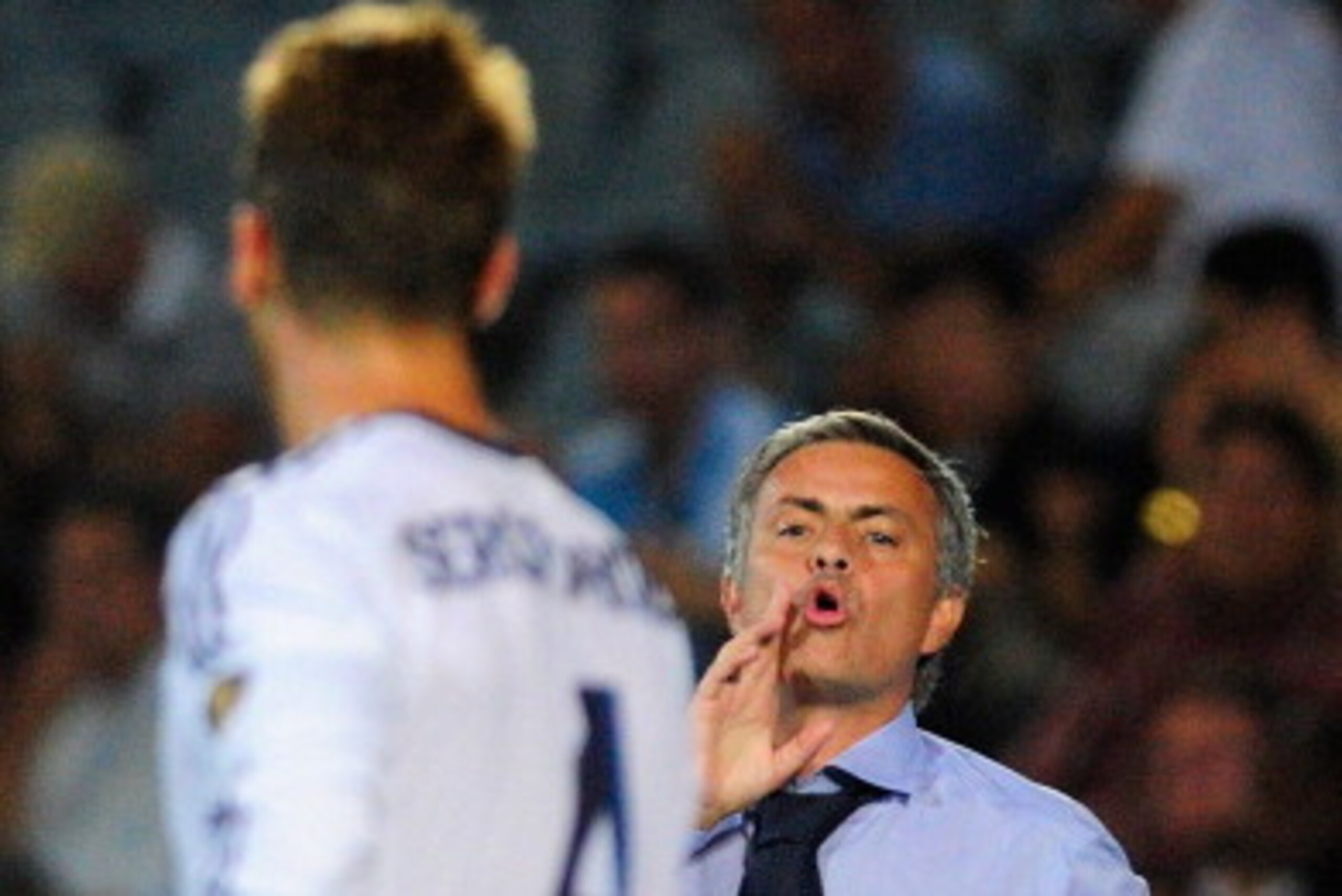 GETAFE, SPAIN - AUGUST 26: Head Coach Jose Mourinho of Real Madrid gives instrucctions to Sergio Ramos during the la Liga match between Getafe and Real Madrid at Coliseum Alfonso Perez on August 26, 2012 in Getafe, Spain.  (Photo by Gonzalo Arroyo Moreno/