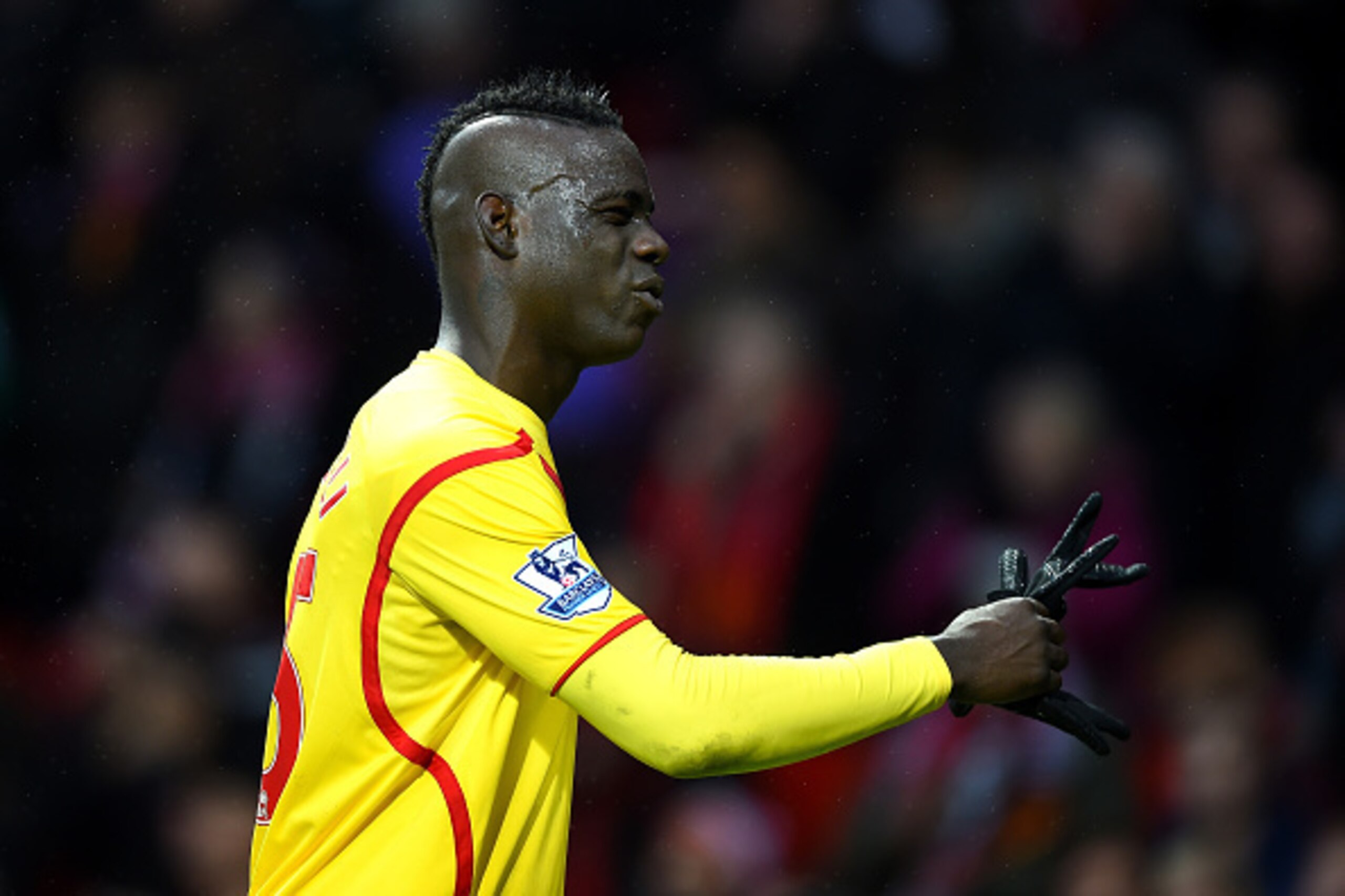 MANCHESTER, ENGLAND - DECEMBER 14:  Mario Balotelli of Liverpool shows his dejection at the end of the Barclays Premier League match between Manchester United and Liverpool at Old Trafford on December 14, 2014 in Manchester, England.  (Photo by Shaun Bott