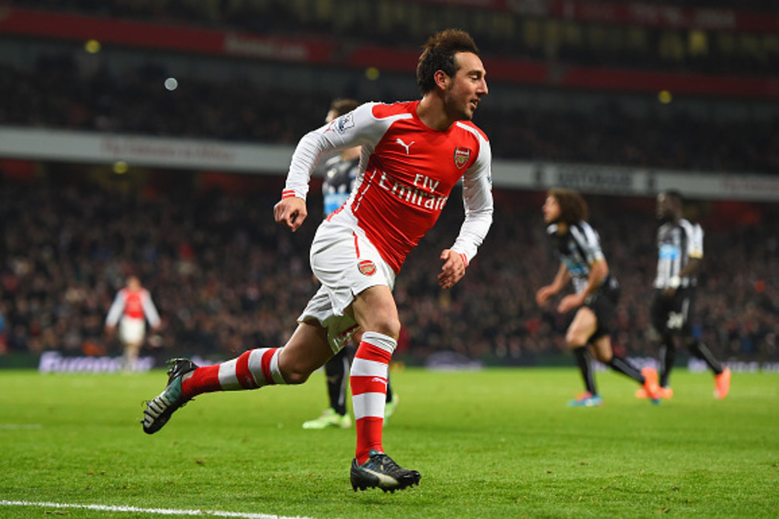 LONDON, ENGLAND - DECEMBER 13:  Santi Cazorla of Arsenal celebrates scoring his team's second goal during the Barclays Premier League match between Arsenal and Newcastle United at Emirates Stadium on December 13, 2014 in London, England.  (Photo by Paul G