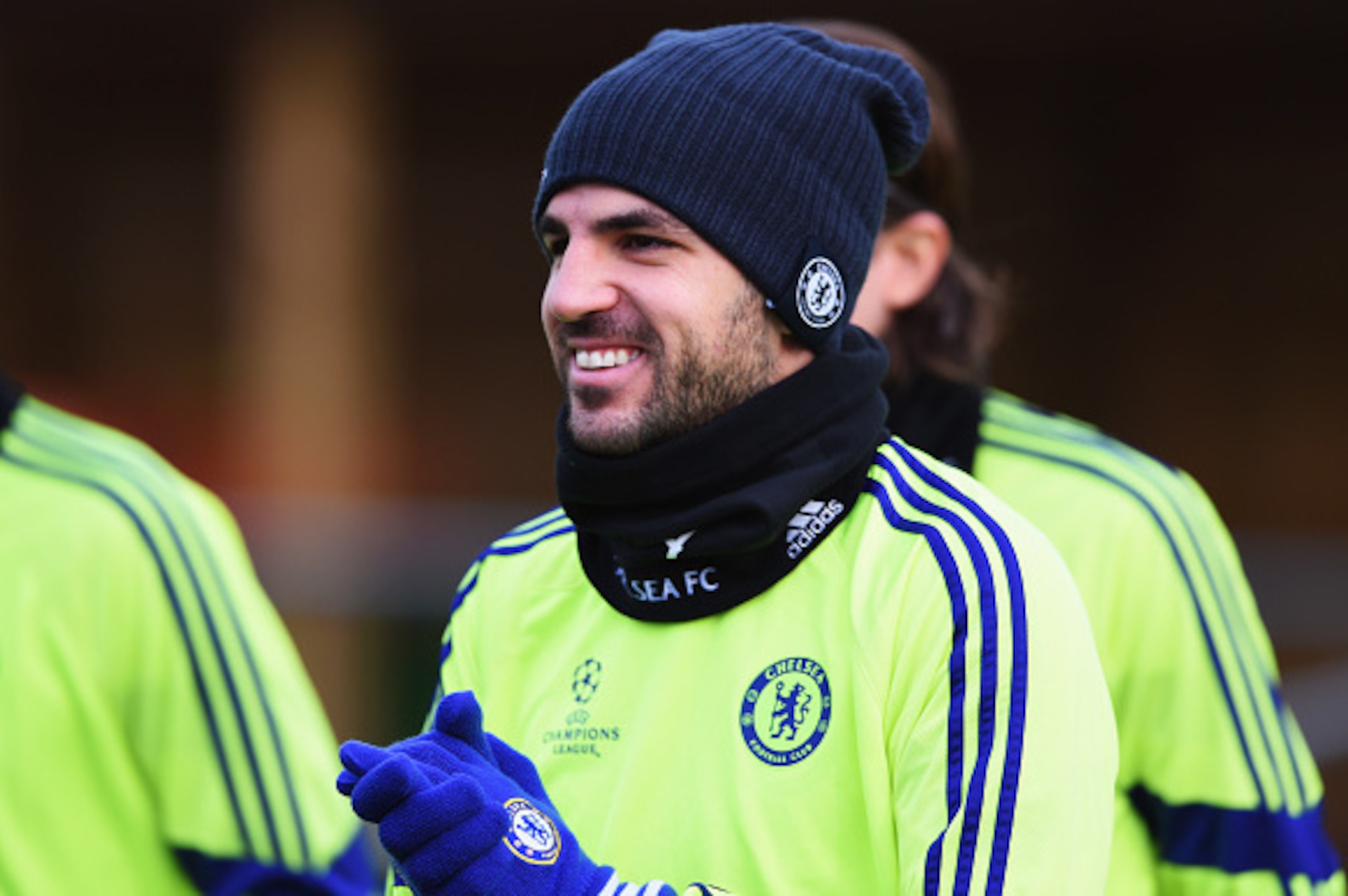 LONDON, ENGLAND - DECEMBER 09: Cesc Fabregas attempts to keep warm during a Chelsea training session, ahead of the UEFA Champions League Group G match, against Sporting Clube de Portugal at Cobham Training Centre on December 9, 2014 in London, United King