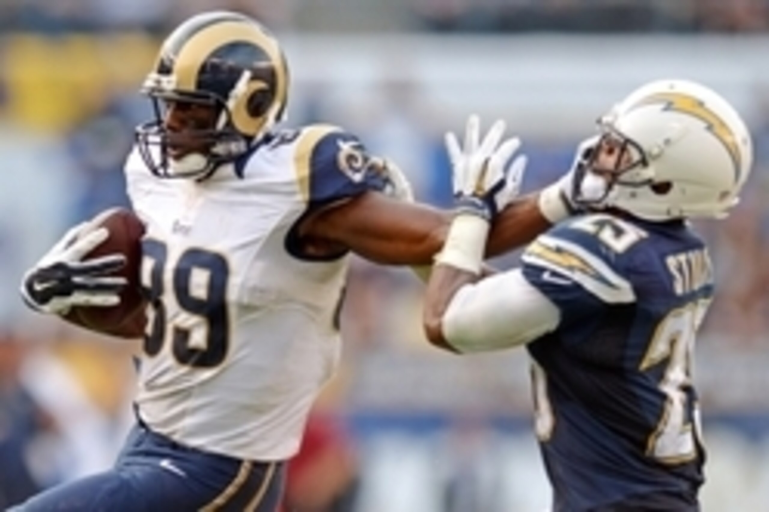 Nov 23, 2014; San Diego, CA, USA; St. Louis Rams tight end Jared Cook (89) stiff arms San Diego Chargers defensive back Darrell Stuckey (25) during the fourth quarter at Qualcomm Stadium. Mandatory Credit: Jake Roth-USA TODAY Sports