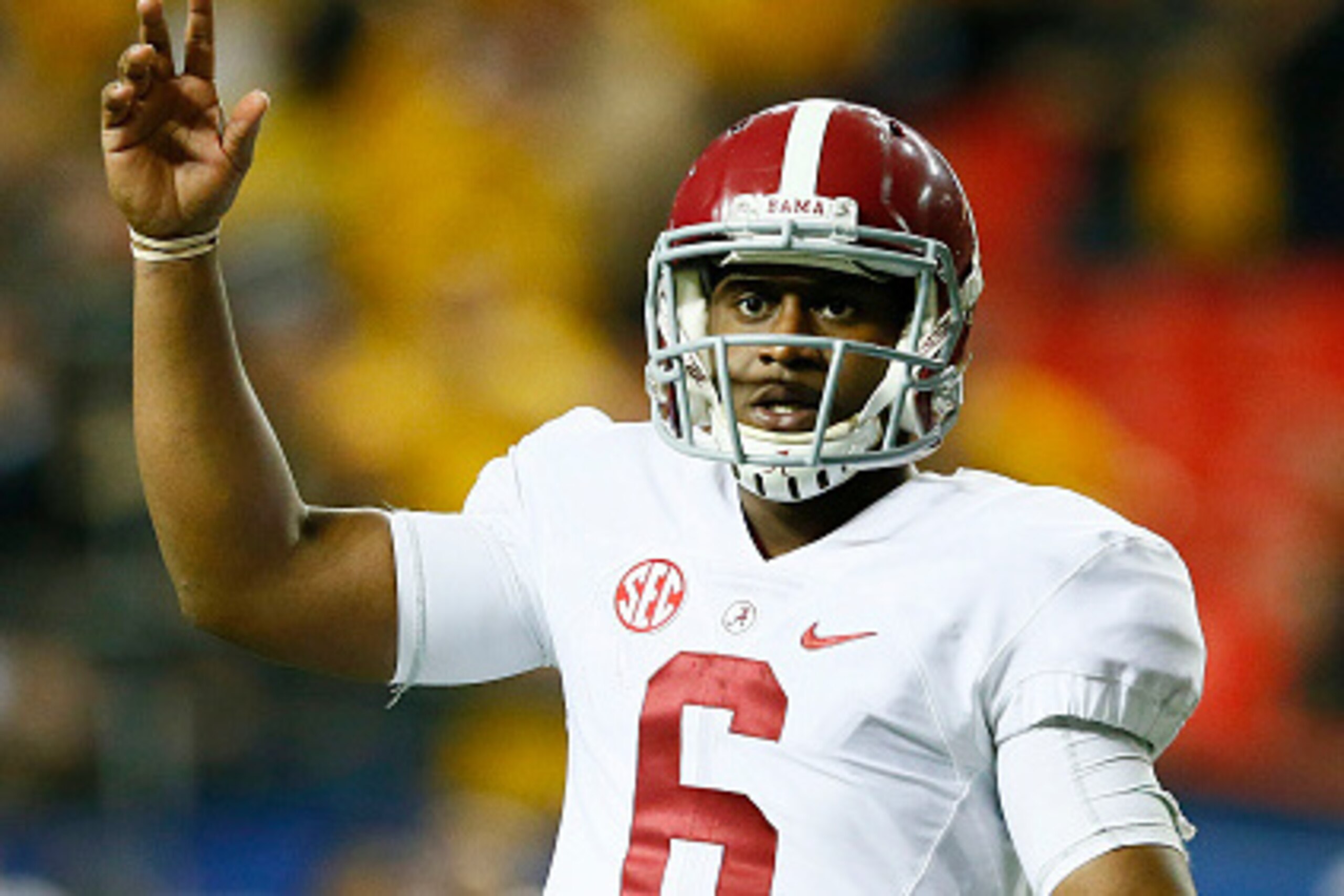 ATLANTA, GA - DECEMBER 06:  Blake Sims #6 of the Alabama Crimson Tide reacts after throwing a touchdown pass to Derrick Henry #27 against the Missouri Tigers in the fourth quarter of the SEC Championship game at the Georgia Dome on December 6, 2014 in Atl