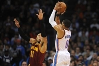 Dec 11, 2014; Oklahoma City, OK, USA; Oklahoma City Thunder guard Russell Westbrook (0) attempts a shot against Cleveland Cavaliers forward Shawn Marion (31) during the second quarter at Chesapeake Energy Arena. Mandatory Credit: Mark D. Smith-USA TODAY S