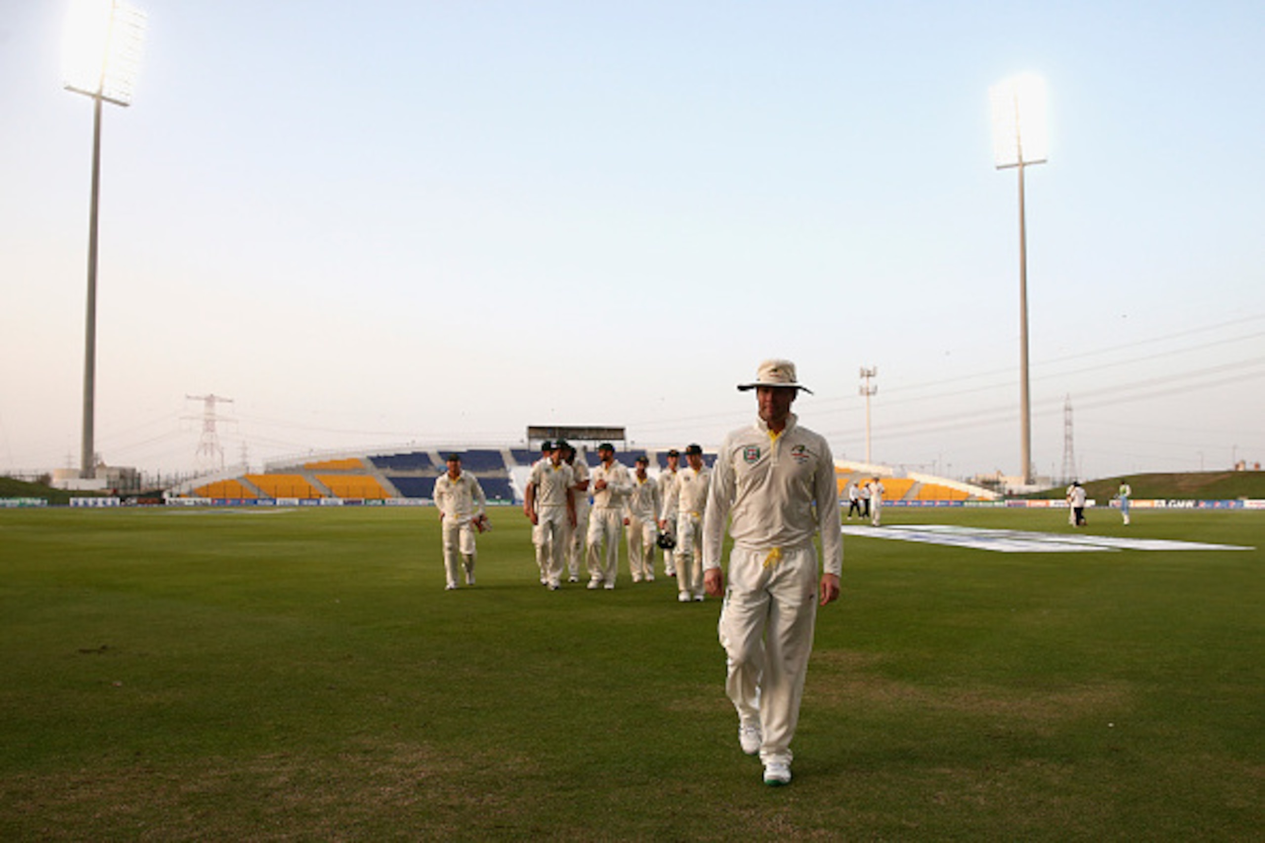 ABU DHABI, UNITED ARAB EMIRATES - NOVEMBER 01:  Michael Clarke of Australia leads his team from the field as bad light stopped play during Day Three of the Second Test between Pakistan and Australia at Sheikh Zayed Stadium on November 1, 2014 in Abu Dhabi