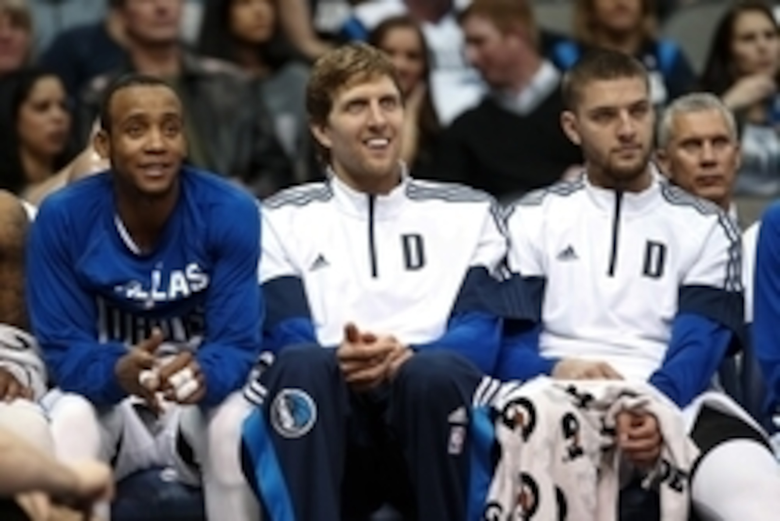 Nov 15, 2014; Dallas, TX, USA; Dallas Mavericks guard Monta Ellis (left) and forward Dirk Nowitzki (middle) and forward Chandler Parsons (right) laugh during the fourth quarter against the Minnesota Timberwolves at American Airlines Center. Mandatory Cred