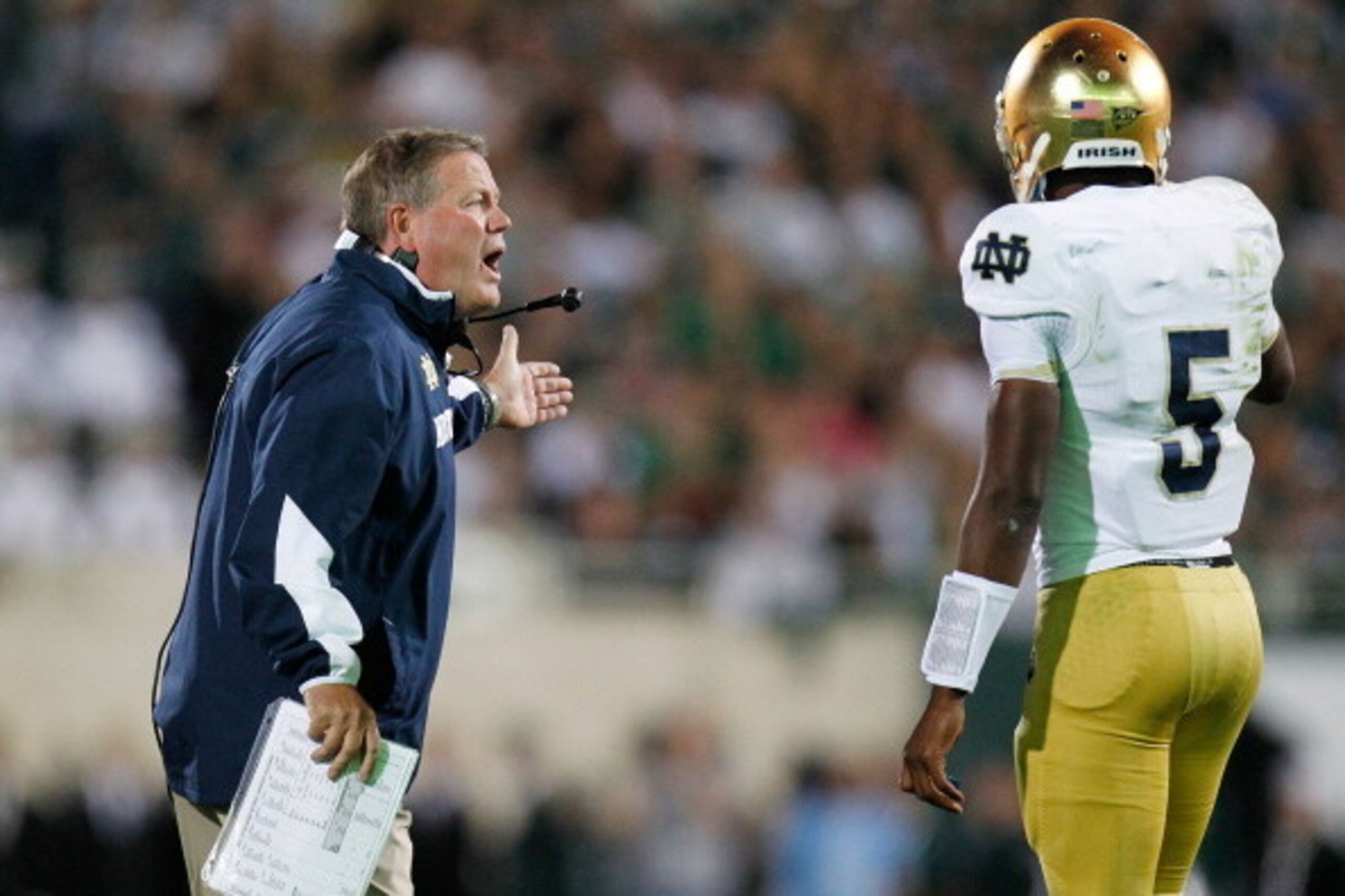 EAST LANSING, MI - SEPTEMBER 15:  Head coach Brian Kelly of the Notre Dame Fighting Irish talks to quarterback Everett Golson #5 while playing the Michigan State Spartans at Spartan Stadium Stadium on September 15, 2012 in East Lansing, Michigan. Notre Da