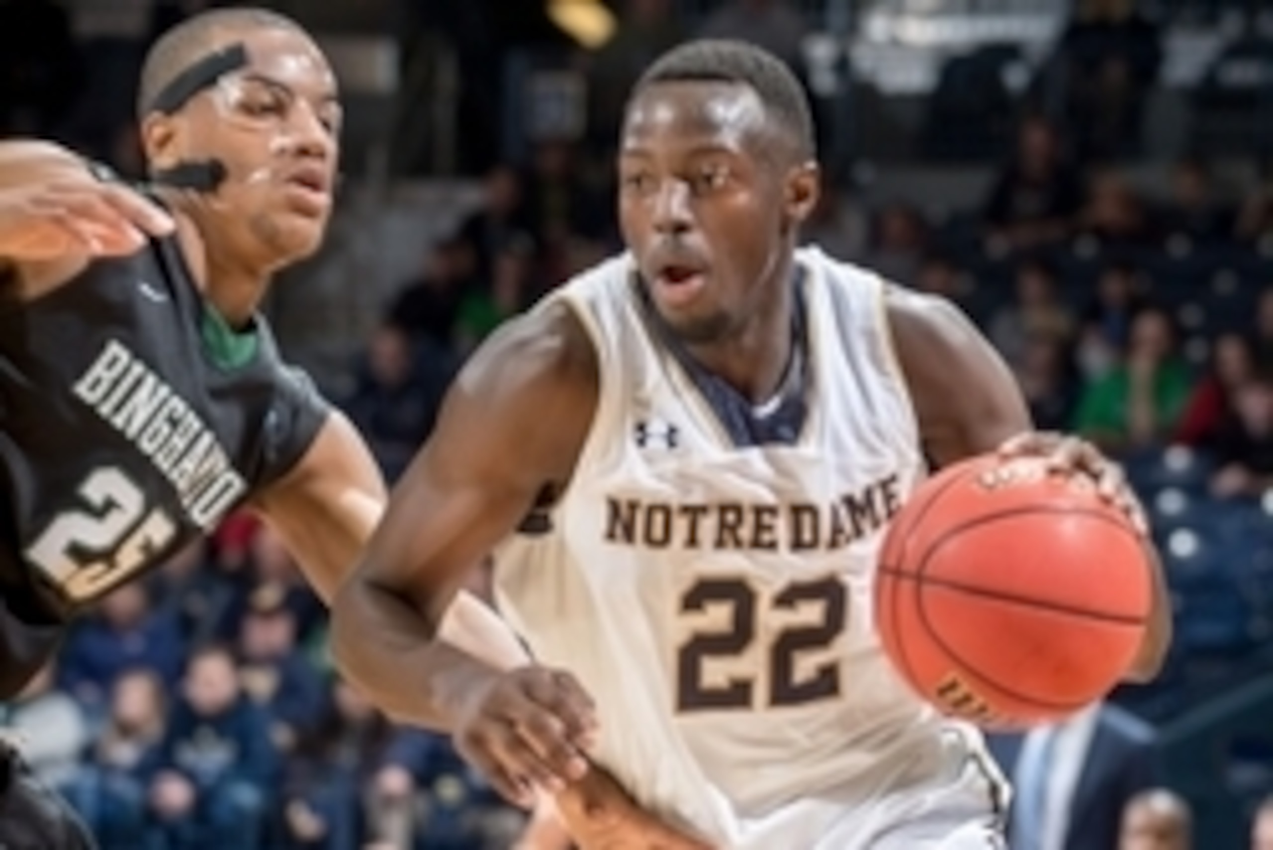 Nov 14, 2014; South Bend, IN, USA; Notre Dame Fighting Irish guard Jerian Grant (22) drives to the basket as Binghamton Bearcats guard Justin McFadden (25) defends in the first half at the Purcell Pavilion. Mandatory Credit: Matt Cashore-USA TODAY Sports Nov 14, 2014; South Bend, IN, USA; Notre Dame Fighting Irish guard Jerian Grant (22) drives to the basket as Binghamton Bearcats guard Justin McFadden (25) defends in the first half at the Purcell Pavilion. Mandatory Credit: Matt Cashore-USA TODAY Sports