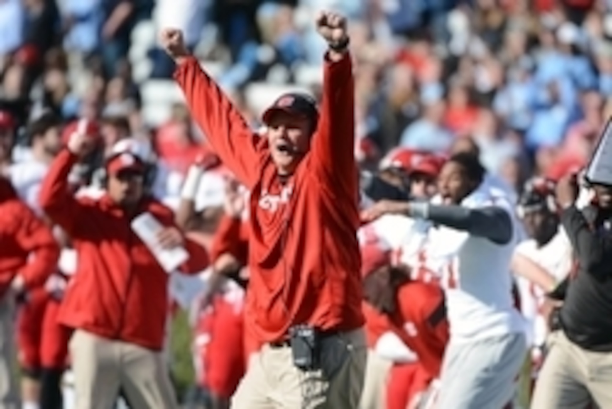 Nov 29, 2014; Chapel Hill, NC, USA; North Carolina State Wolfpack head coach Dave Doeren (center) reacts to a missed field goal by the North Carolina Tar Heels during the first half at Kenan Memorial Stadium  Mandatory Credit: Rob Kinnan-USA Today.