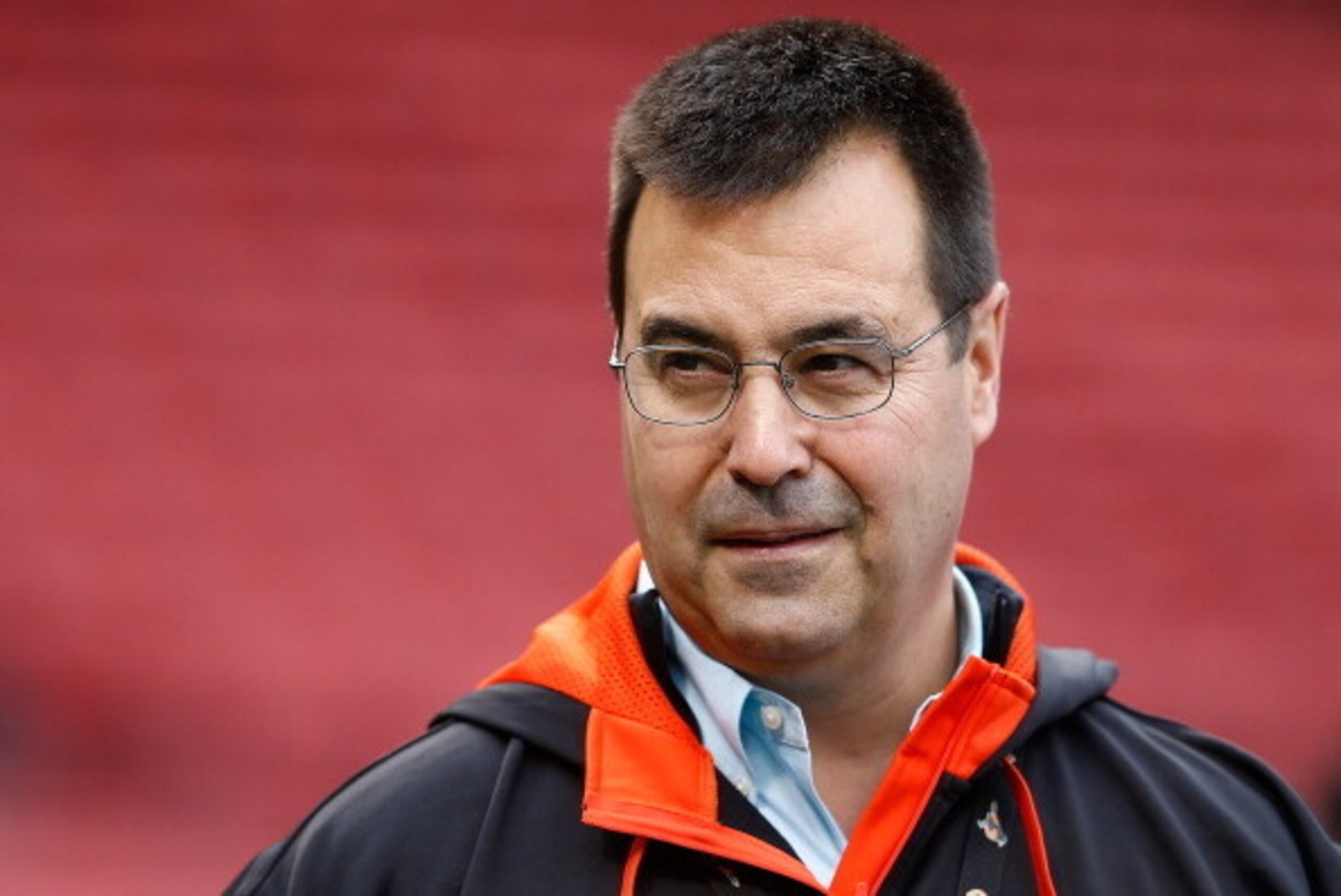BOSTON, MA - APRIL 18: Dan Duquette, general manager of the Baltimore Orioles, watches batting practice before a game with the Boston Red Sox at Fenway Park on April 18, 2014 in Boston, Massachusetts.  (Photo by Jim Rogash/Getty Images)