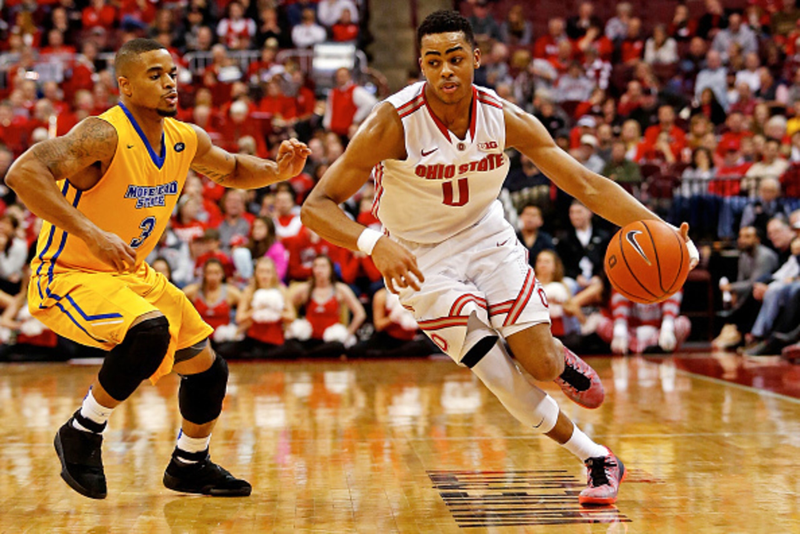COLUMBUS, OH - DECEMBER 13:  D'Angelo Russell #0 of the Ohio State Buckeyes drives the ball past Corban Collins #3 of the Morehead State Eagles during the second half at Value City Arena on December 13, 2014 in Columbus, Ohio. Ohio State defeated Morhead 