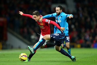 MANCHESTER, ENGLAND - DECEMBER 02:  Ander Herrera of Manchester United competes with Marc Wilson of Stoke City during the Barclays Premier League match between Manchester United and Stoke City at Old Trafford on December 2, 2014 in Manchester, England.  (