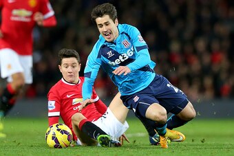 MANCHESTER, ENGLAND - DECEMBER 02:  Ander Herrera of Manchester United challenges Bojan Krkic of Stoke City during the Barclays Premier League match between Manchester United and Stoke City at Old Trafford on December 2, 2014 in Manchester, England.  (Pho