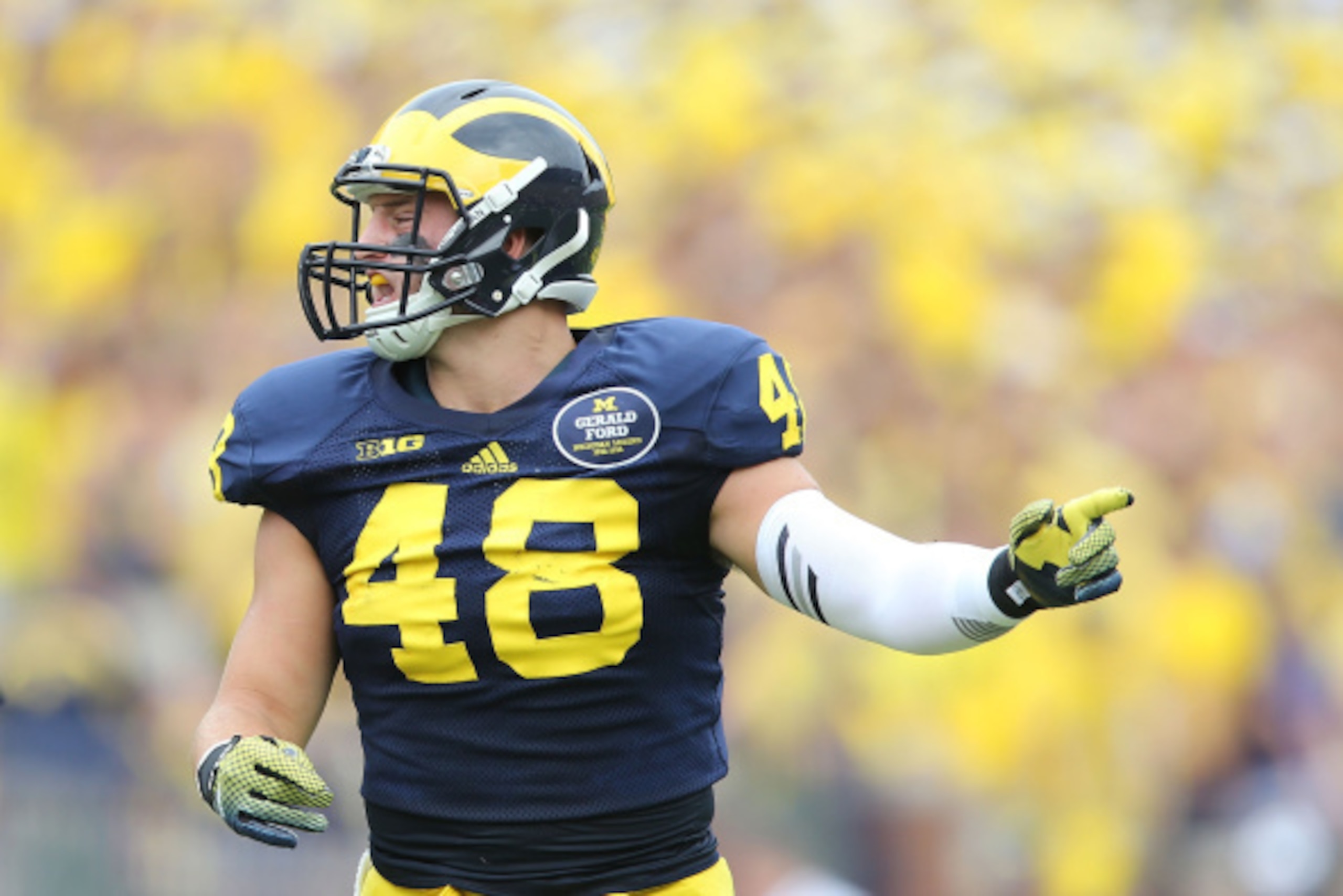 ANN ARBOR, MI - AUGUST 30:  Desmond Morgan #48 of the Michigan Wolverines looks to make the stop during the first half of the game against the Appalachian State Mountaineers on August 30, 2014 in Ann Arbor, Michigan. The Wolverines defeated the Mountainee