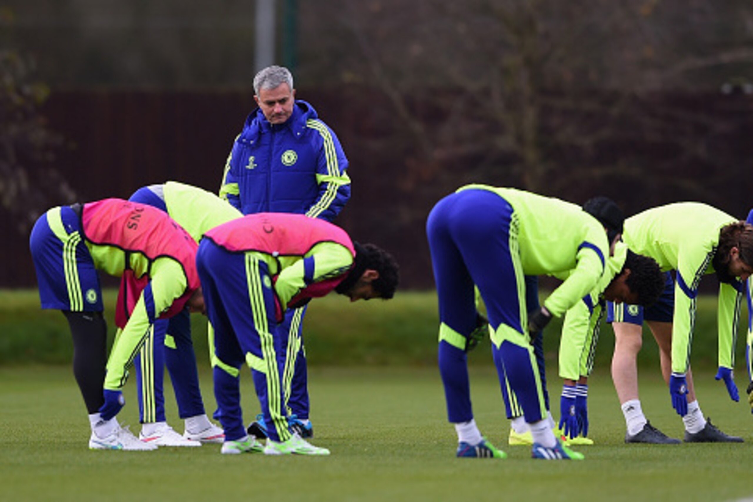 LONDON, ENGLAND - DECEMBER 09: Manager Jose Mourinho of Chelsea looks on as his players warm up during a Chelsea press conference, ahead of the UEFA Champions League Group G match, against Sporting Clube de Portugal at Cobham Training Centre on December LONDON, ENGLAND - DECEMBER 09: Manager Jose Mourinho of Chelsea looks on as his players warm up during a Chelsea press conference, ahead of the UEFA Champions League Group G match, against Sporting Clube de Portugal at Cobham Training Centre on December