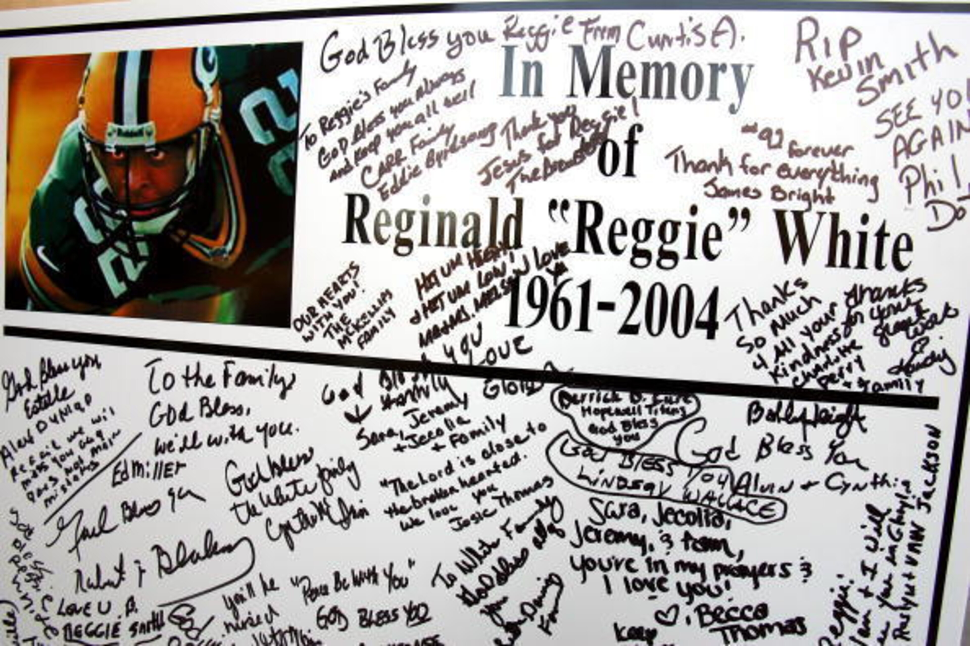 CHARLOTTE, NC - DECEMBER 29:  A poster signed by family and friends sits on display at a memorial service for former NFL great Reggie White at A.L. Jinwright Funeral Service on December 29, 2004 in Charlotte, North Carolina. White died in his sleep Decemb