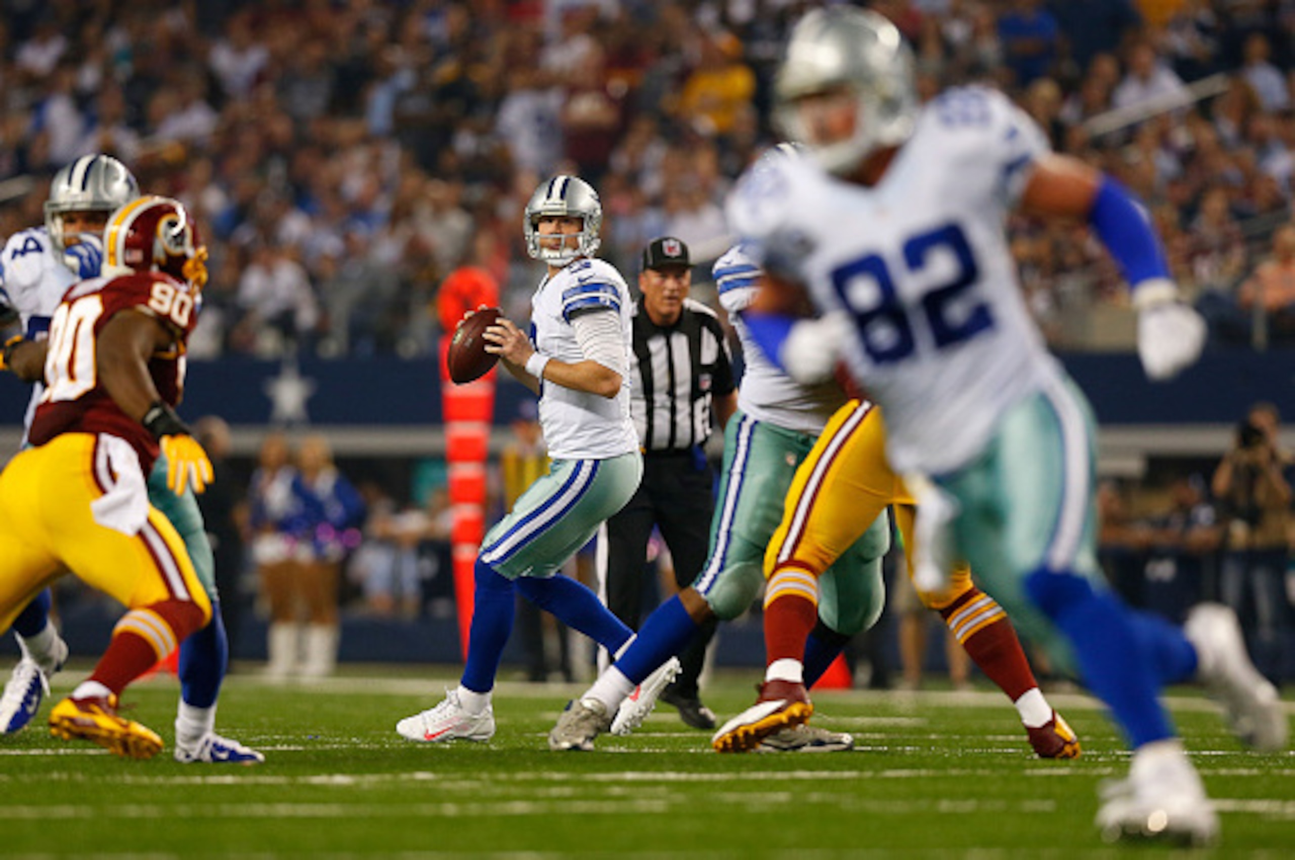 ARLINGTON, TX - OCTOBER 27:  Brandon Weeden #3 of the Dallas Cowboys looks downfield as Jason Witten #82 of the Dallas Cowboys cuts across the middle against the Washington Redskins during the second half at AT&T Stadium on October 27, 2014 in Arlington, 