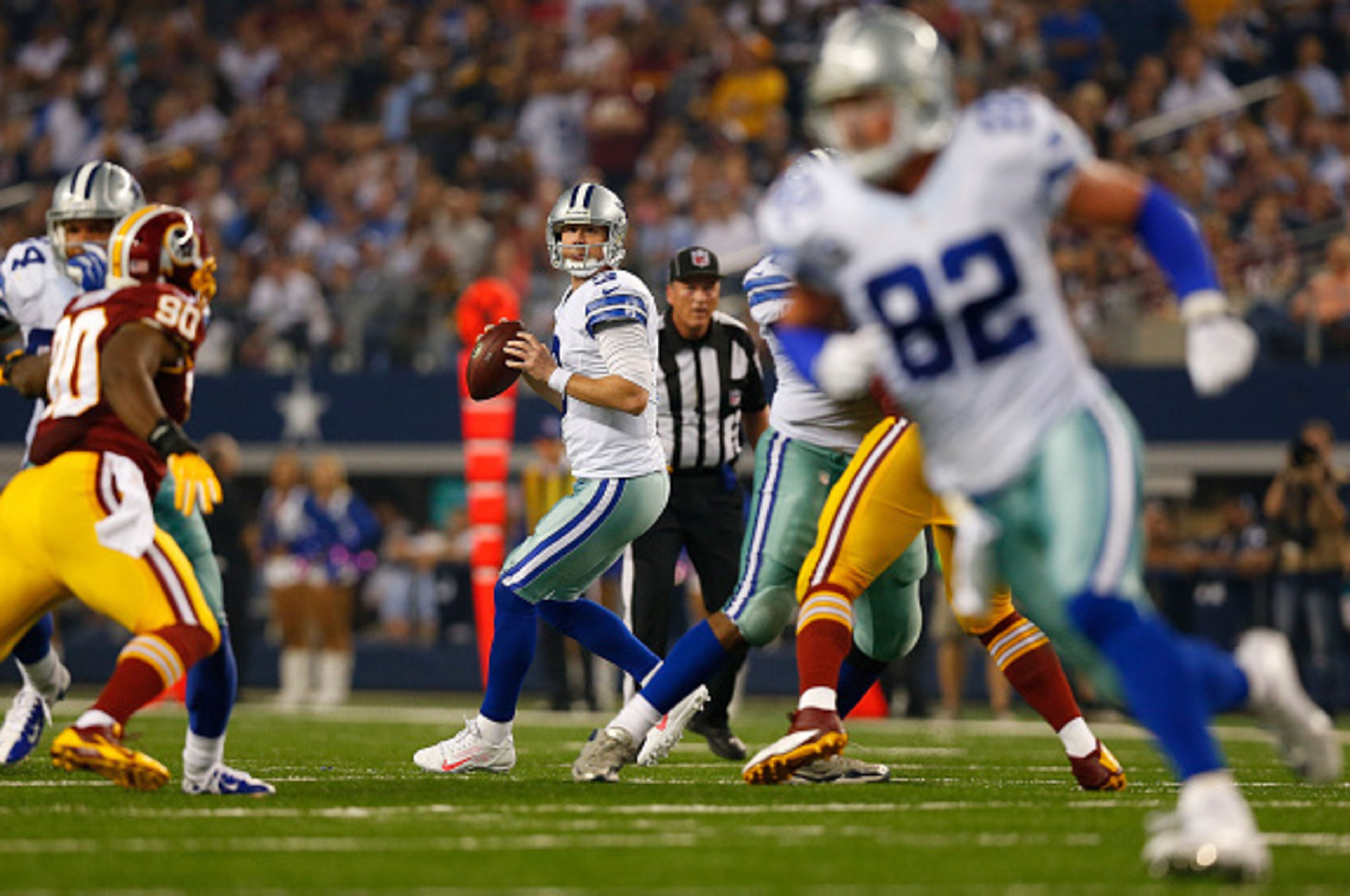 ARLINGTON, TX - OCTOBER 27:  Brandon Weeden #3 of the Dallas Cowboys looks downfield as Jason Witten #82 of the Dallas Cowboys cuts across the middle against the Washington Redskins during the second half at AT&T Stadium on October 27, 2014 in Arlington, 