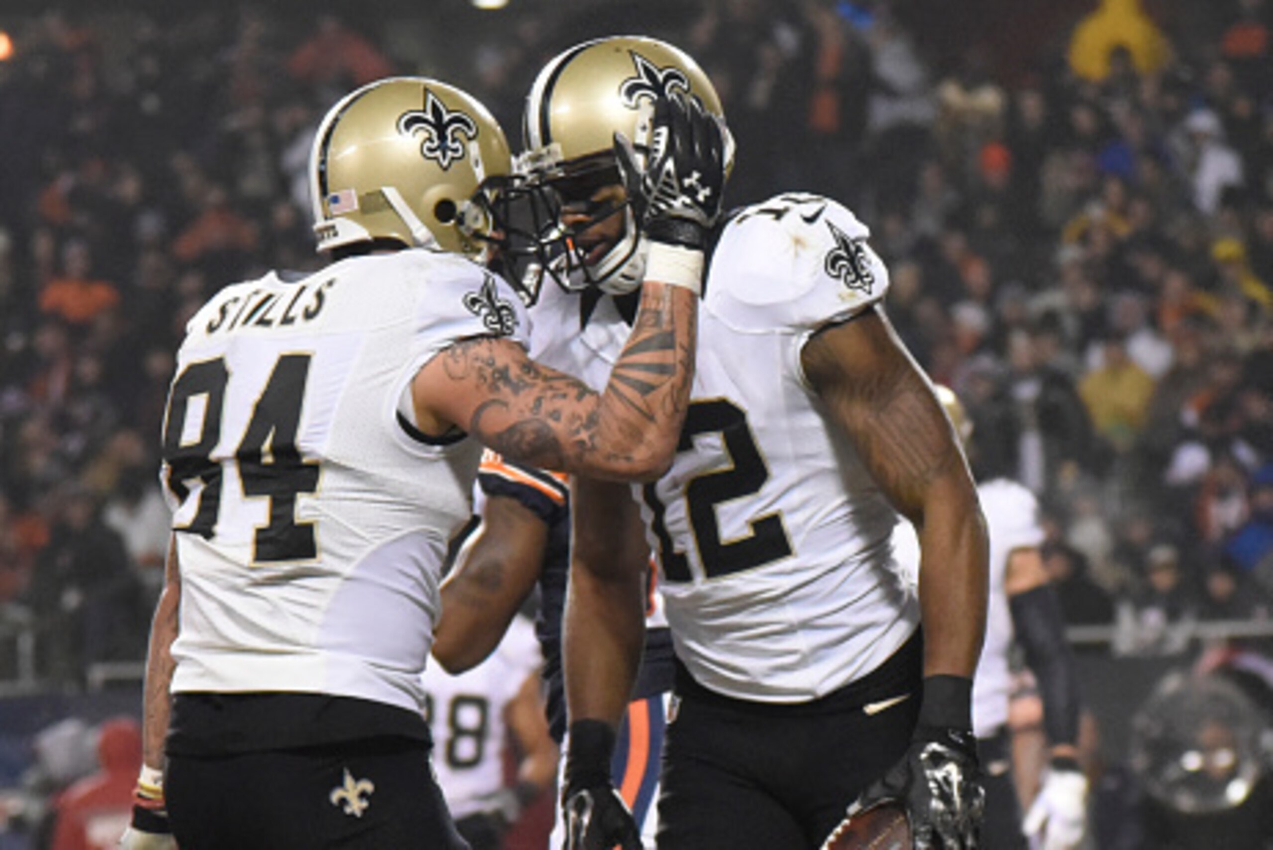 CHICAGO, IL - DECEMBER 15: Marques Colston #12 of the New Orleans Saints celebrates his touchdown with Kenny Stills #84 during the second quarter against the Chicago Bears on December 15, 2014 at Soldier Field in Chicago, Illinois.   (Photo by David Banks