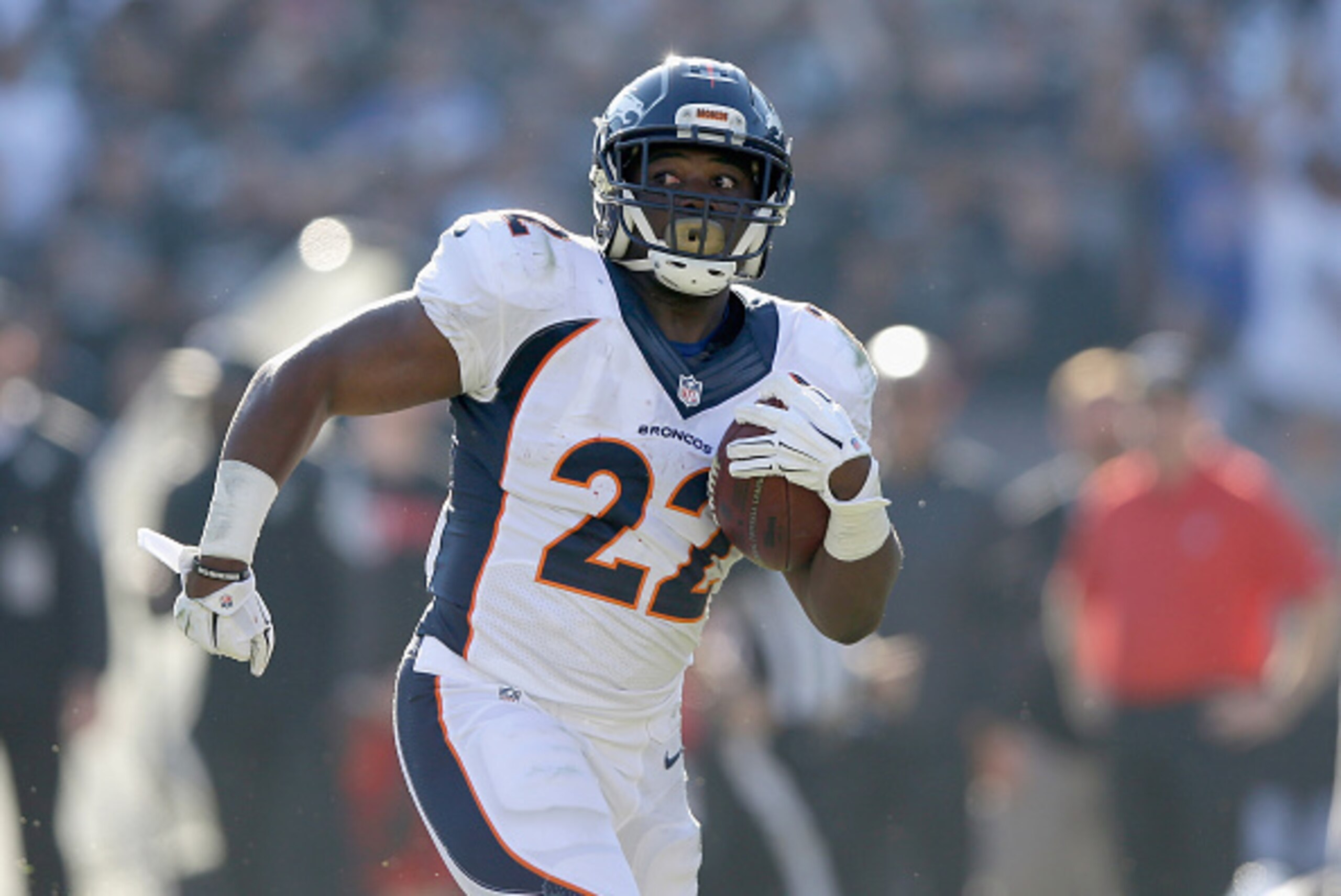 OAKLAND, CA - NOVEMBER 09:  C.J. Anderson #22 of the Denver Broncos carries for a touchdown in the first half against the Oakland Raiders at O.co Coliseum on November 9, 2014 in Oakland, California.  (Photo by Ezra Shaw/Getty Images)