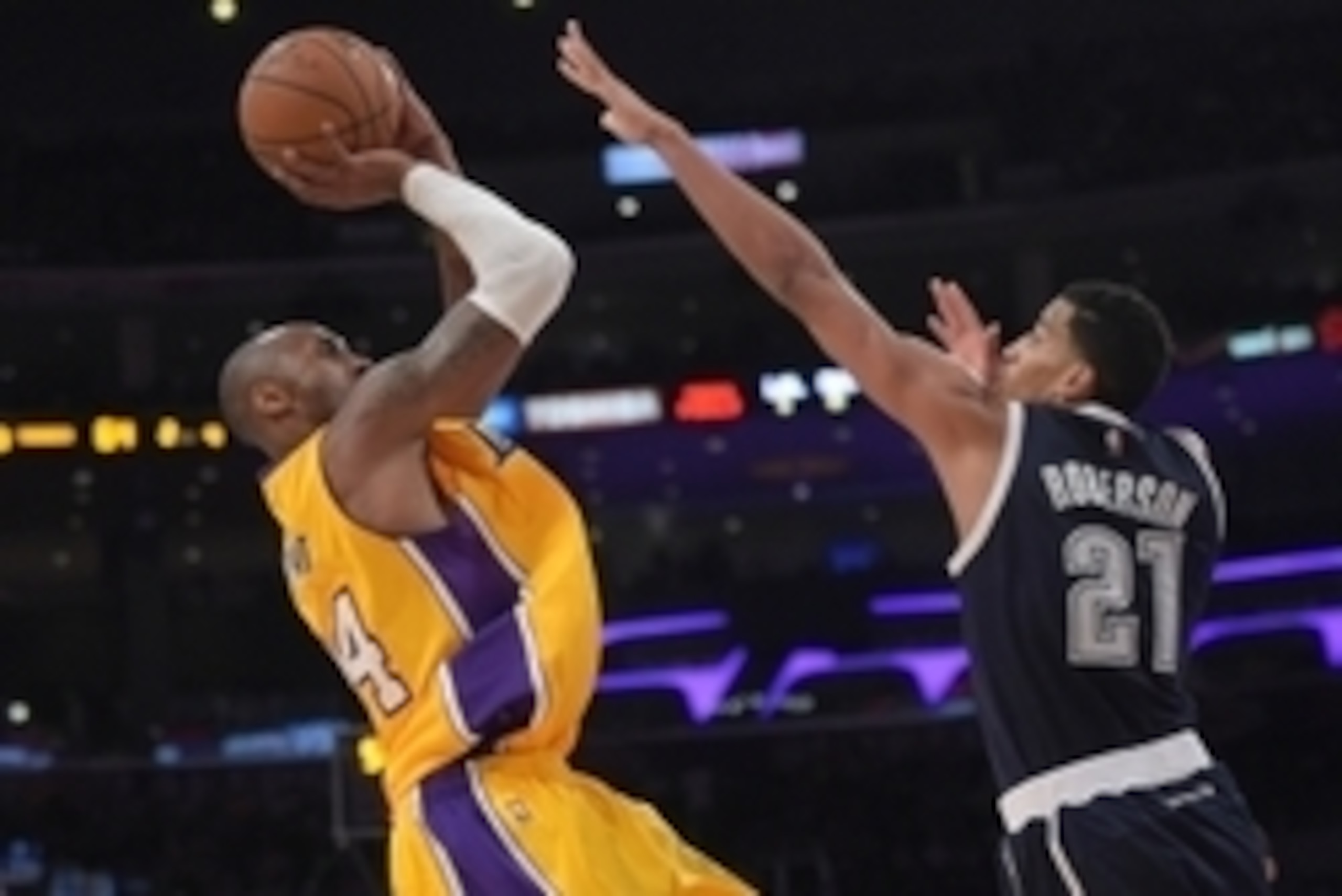 Dec 19, 2014; Los Angeles, CA, USA; Los Angeles Lakers guard Kobe Bryant (24) shoots the ball as Oklahoma City Thunder guard Andre Roberson (21) defends at Staples Center. The Thunder won 104-103. Mandatory Credit: Kirby Lee-USA TODAY Sports