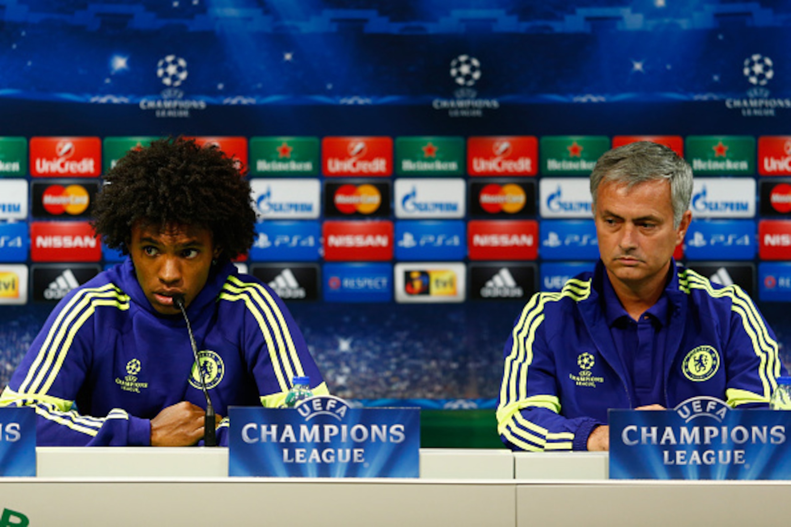 LISBON, PORTUGAL - SEPTEMBER 29:  Willian of Chelsea and Jose Mourinho, coach of Chelsea talk to the media during a press conference at Estadio Jose Alvalade on September 29, 2014 in Lisbon, Portugal.  (Photo by Julian Finney/Getty Images)