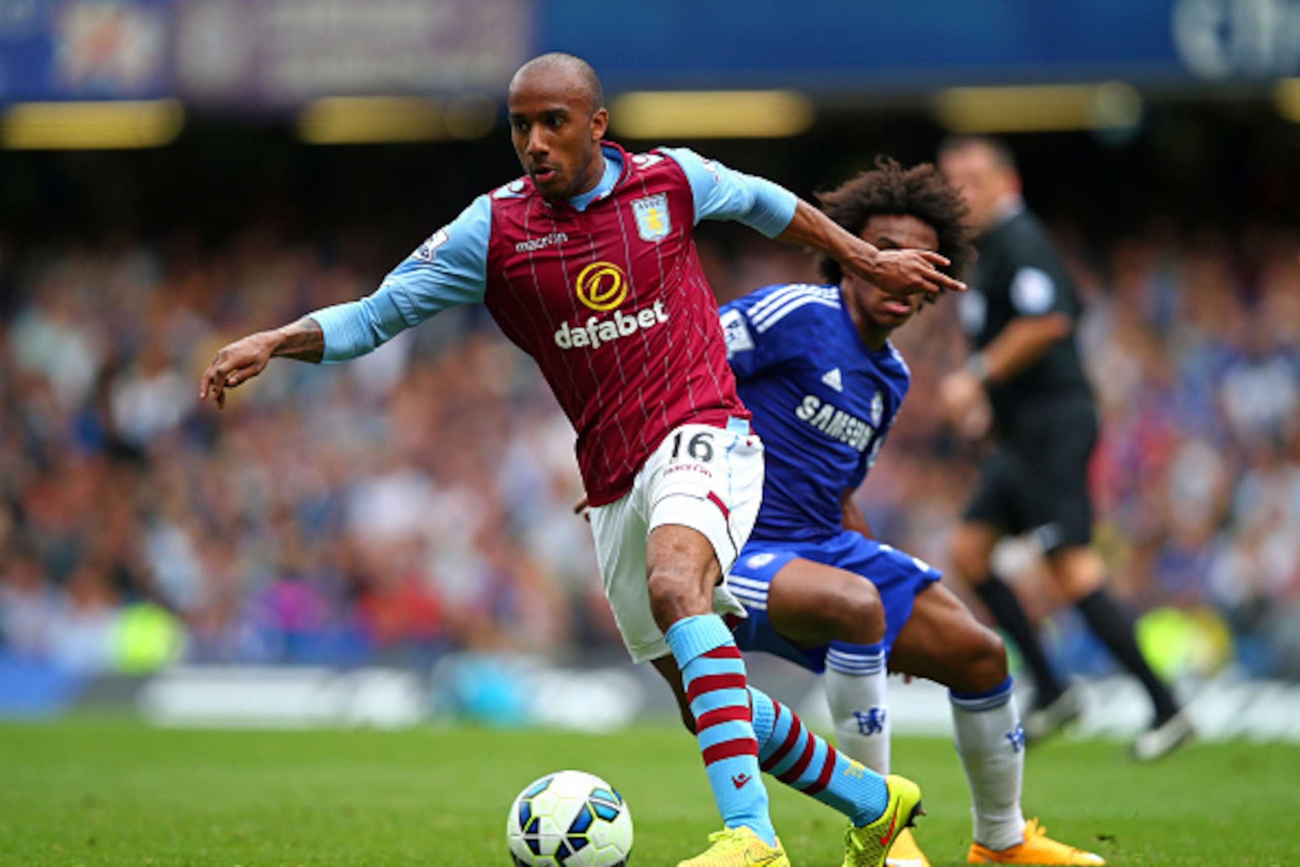 LONDON, ENGLAND - SEPTEMBER 27:  Fabian Delph of Aston Villa goes past the challenge from Willian of Chelsea during the Barclays Premier League match between Chelsea and Aston Villa at Stamford Bridge on September 27, 2014 in London, England.  (Photo by C
