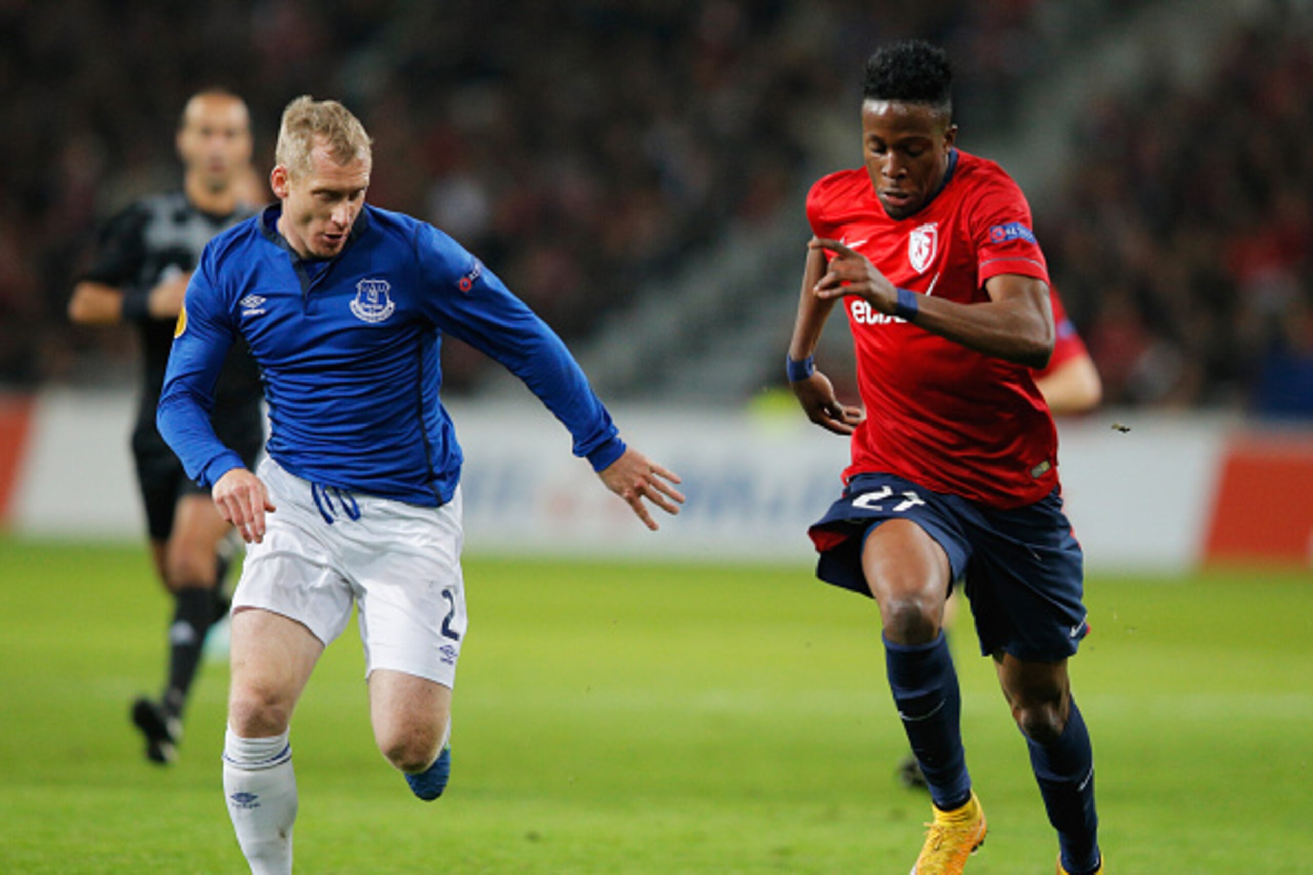 LILLE, FRANCE - OCTOBER 23:  Tony Hibbert of Everton (L) chases Divock Origi of Lille during the UEFA Europa League Group H match between LOSC Lille and Everton at Grand Stade Lille Metropole on October 23, 2014 in Lille, France.  (Photo by Dean Mouhtarop