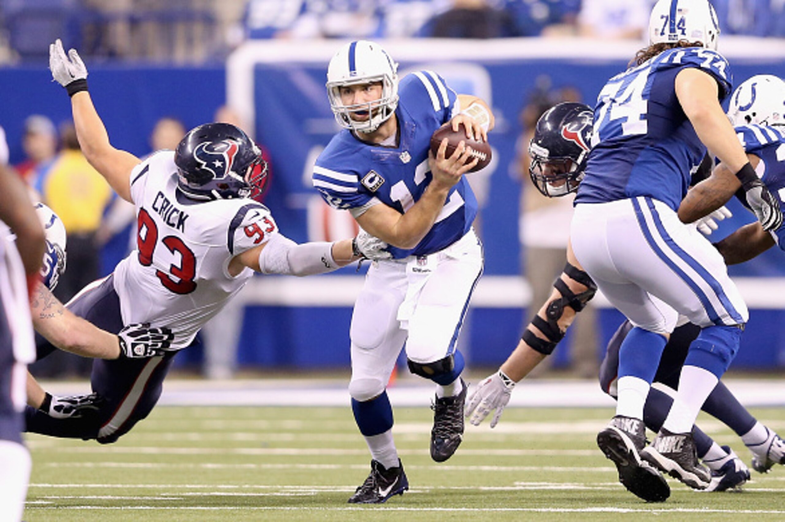 INDIANAPOLIS, IN - DECEMBER 14:  Andrew Luck #12 of the Indianapolis Colts runs with the ball during the game against the Houston Texans at Lucas Oil Stadium on December 14, 2014 in Indianapolis, Indiana.  The Colts won 17-10.  (Photo by Andy Lyons/Getty 