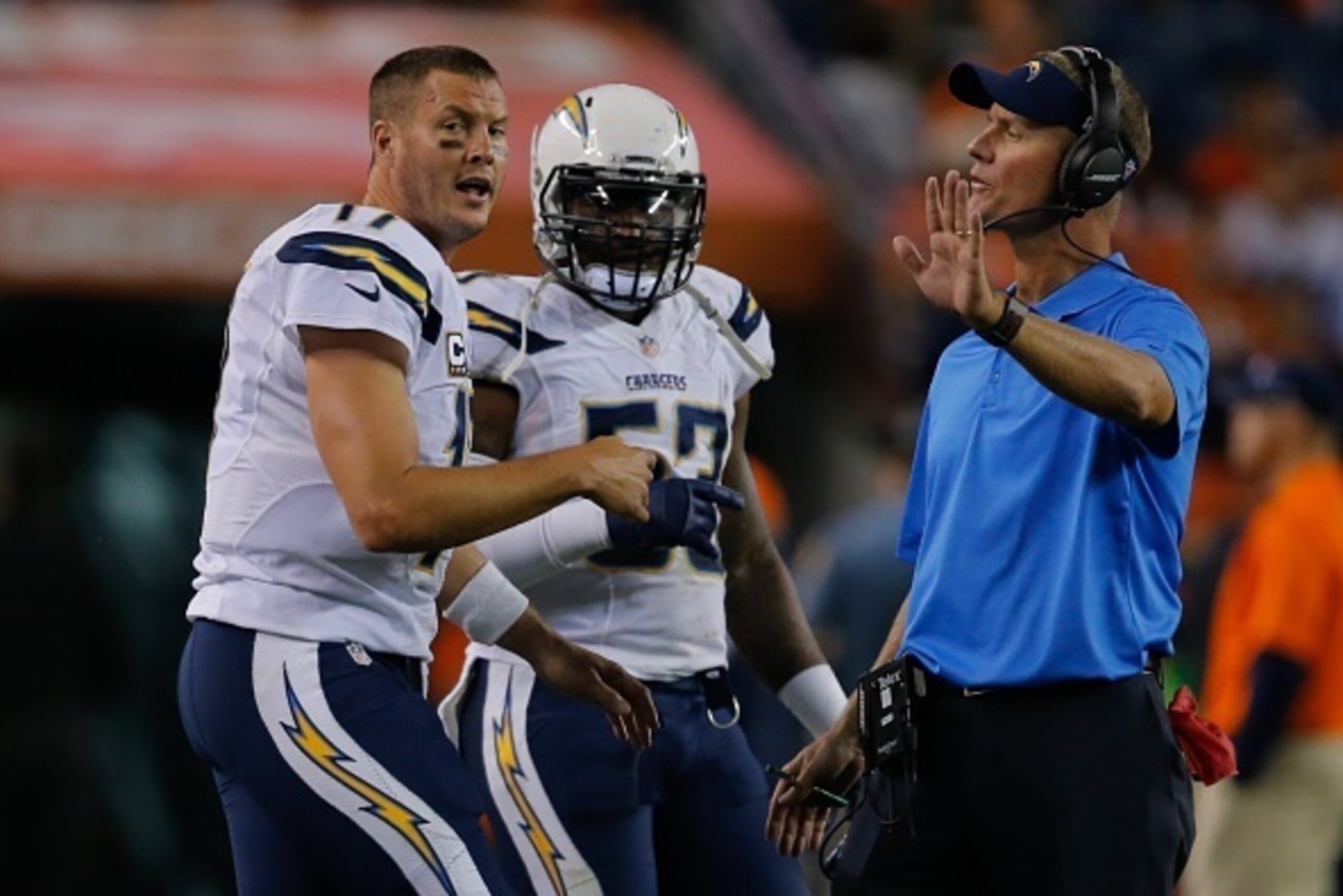 DENVER, CO - OCTOBER 23:  Head coach Mike McCoy of the San Diego Chargers has a word with Philip Rivers #17 during a game against the Denver Broncos at Sports Authority Field at Mile High on October 23, 2014 in Denver, Colorado.  (Photo by Doug Pensinger/