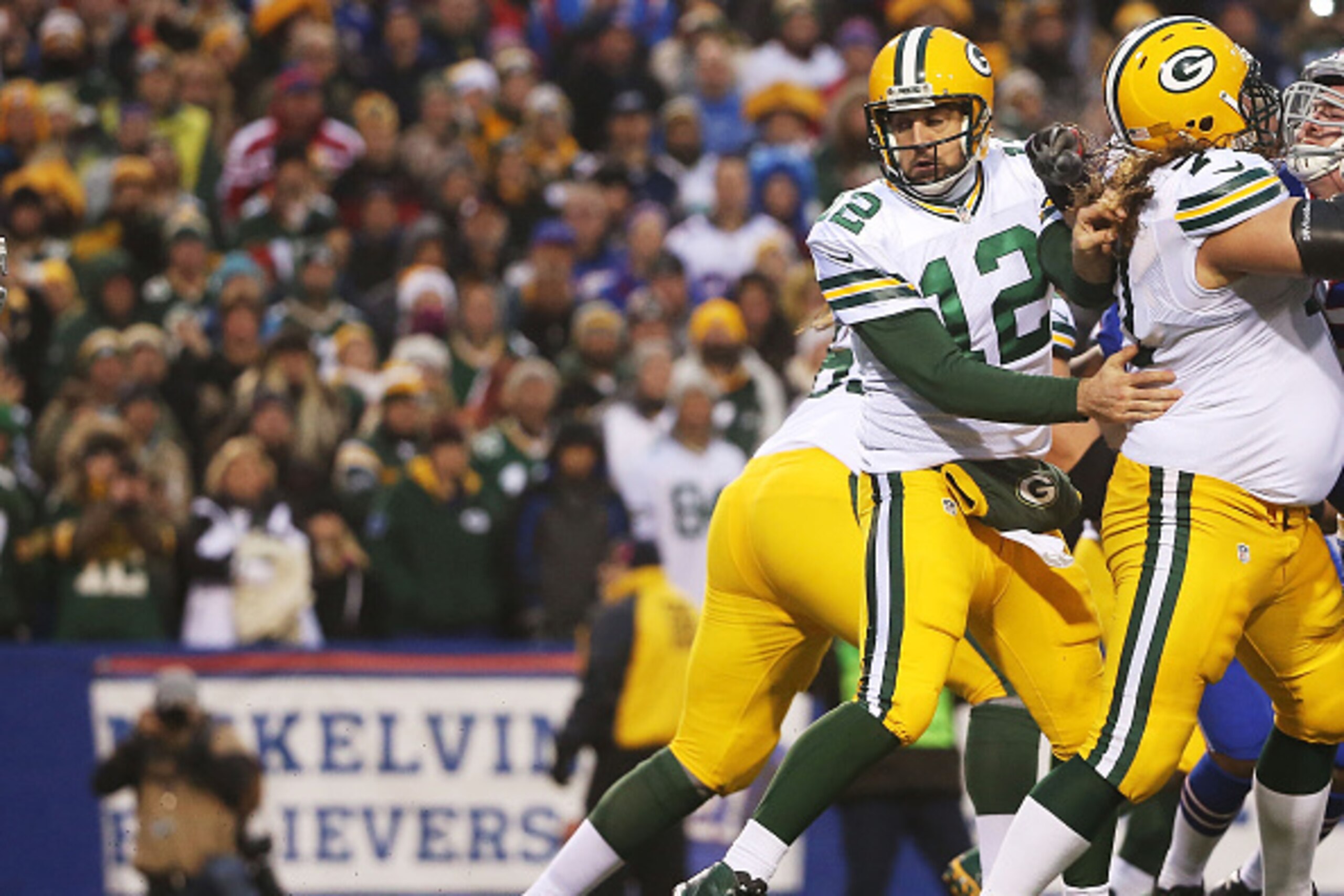 ORCHARD PARK, NY - DECEMBER 14:   Aaron Rodgers #12 of the Green Bay Packers loses the ball resulting in a fumble for a safety during the second half against the Buffalo Bills at Ralph Wilson Stadium on December 14, 2014 in Orchard Park, New York.  (Photo