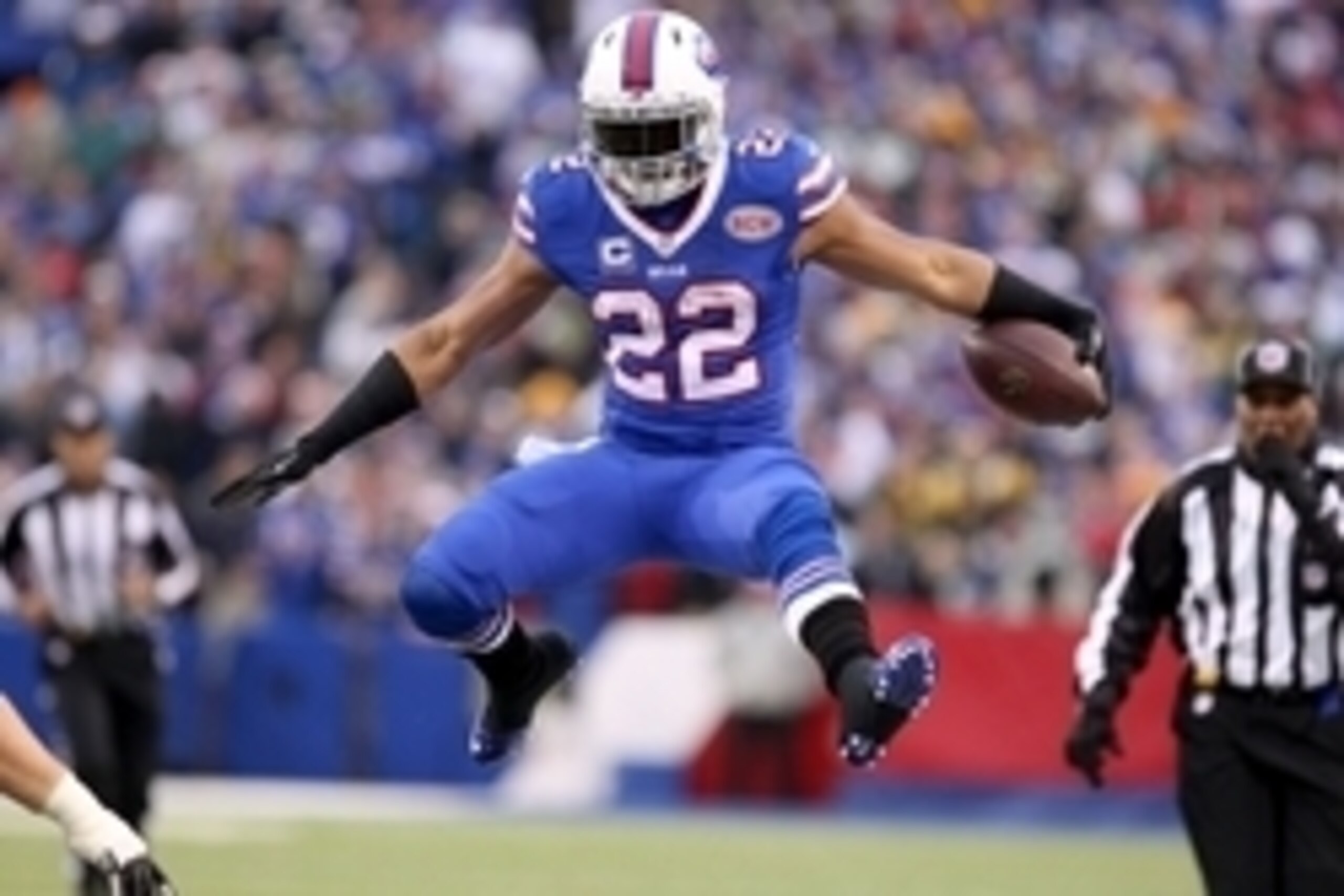 Dec 14, 2014; Orchard Park, NY, USA; Buffalo Bills running back Fred Jackson (22) jumps to avoid a tackle during the second half against the Green Bay Packers at Ralph Wilson Stadium. Buffalo beat Green Bay 21-13. Mandatory Credit: Timothy T. Ludwig-USA T