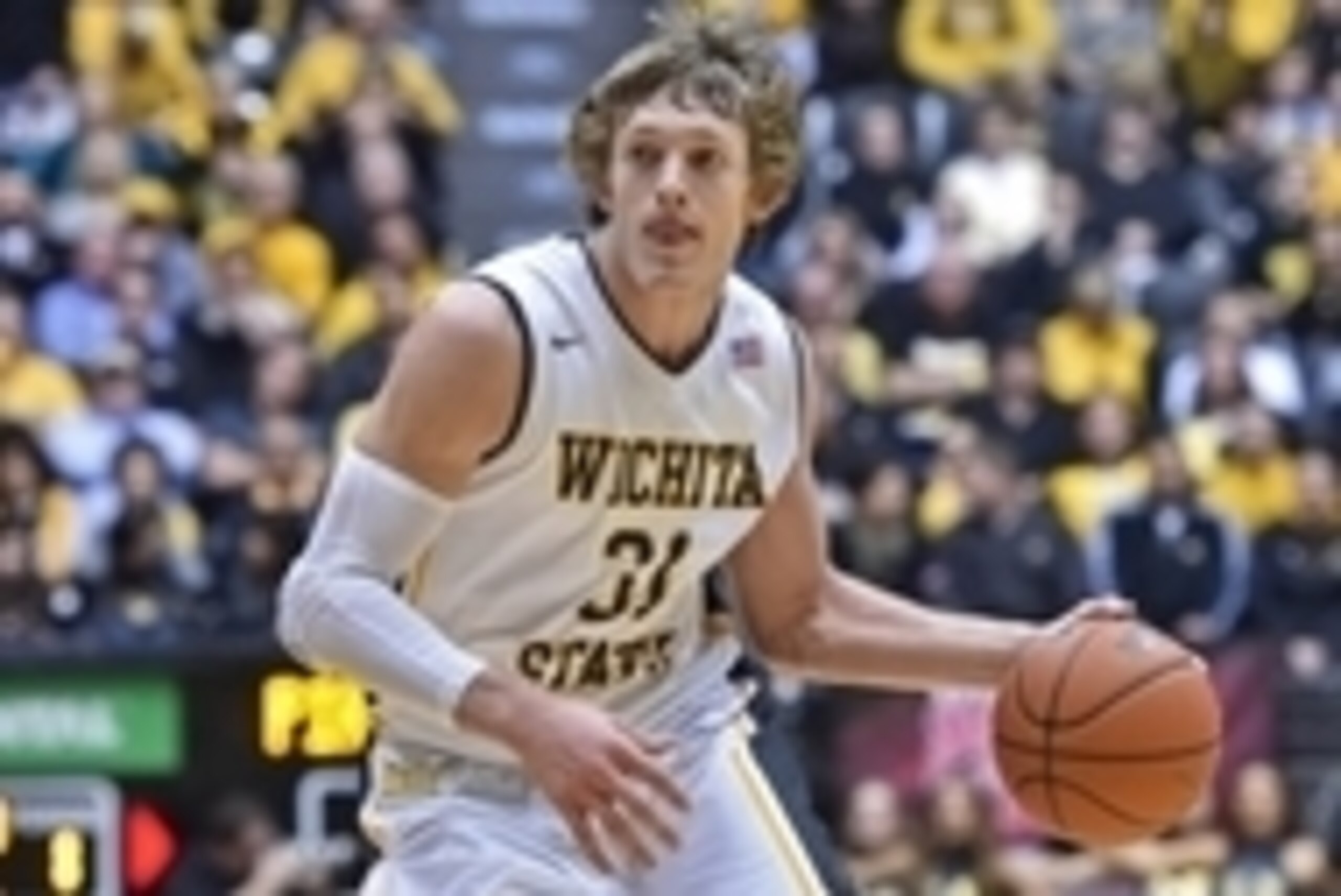 Dec 9, 2014; Wichita, KS, USA; Wichita State Shockers guard Ron Baker (31) dribbles the ball against the Seton Hall Pirates during the first half at Charles Koch Arena. Mandatory Credit: Peter G. Aiken-USA TODAY Sports