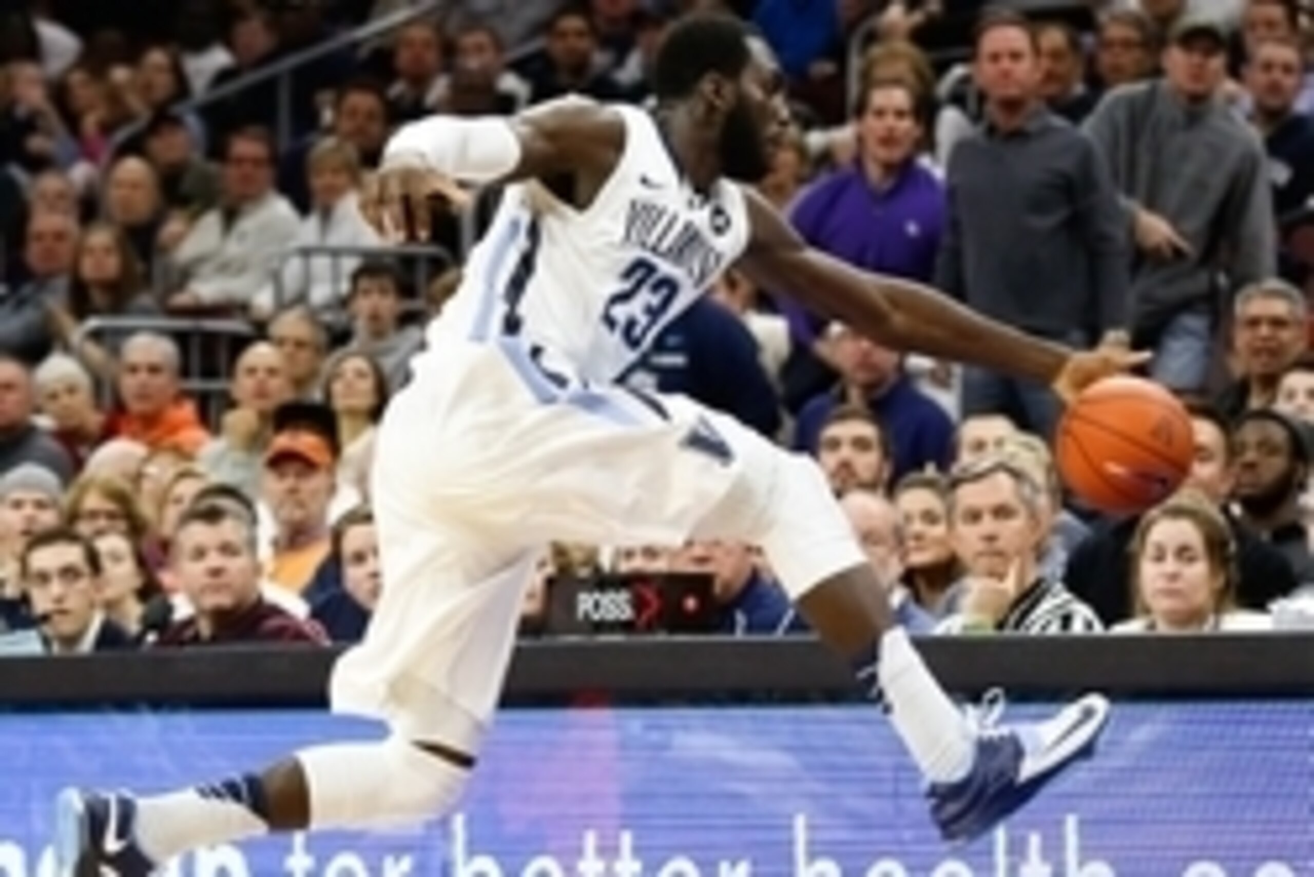 Dec 20, 2014; Villanova, PA, USA; Villanova Wildcats forward Daniel Ochefu (23) lunges to save a ball from going out of bounds during the first half of a game against the Syracuse Orange at The Pavilion. Mandatory Credit: Bill Streicher-USA TODAY Sports