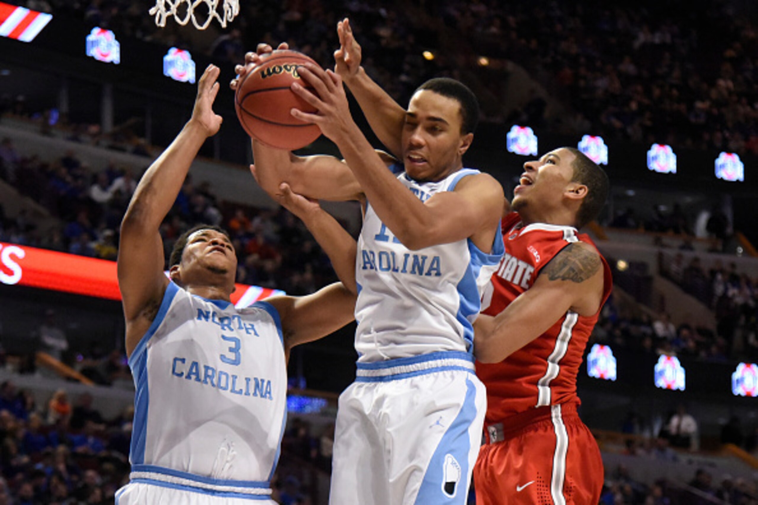 CHICAGO, IL- DECEMBER 20: Brice Johnson #11 of the North Carolina Tar Heels grabs a rebound in front of Marc Loving #2 of the Ohio State Buckeyesduring the second half of the CBS Sports Classic on December 20, 2014 at the United Center in Chicago, Illinoi