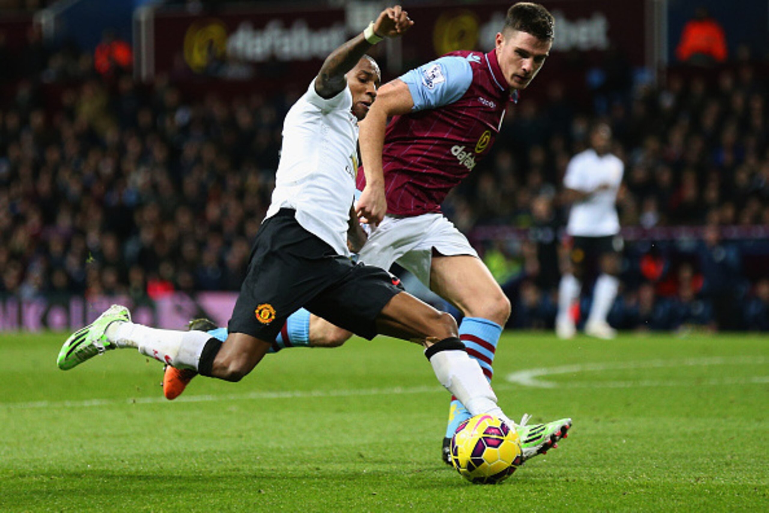 BIRMINGHAM, ENGLAND - DECEMBER 20:  Ashley Young of Manchester United is closed down by Ciaran Clark of Aston Villa during the Barclays Premier League match between Aston Villa and Manchester United at Villa Park on December 20, 2014 in Birmingham, Englan