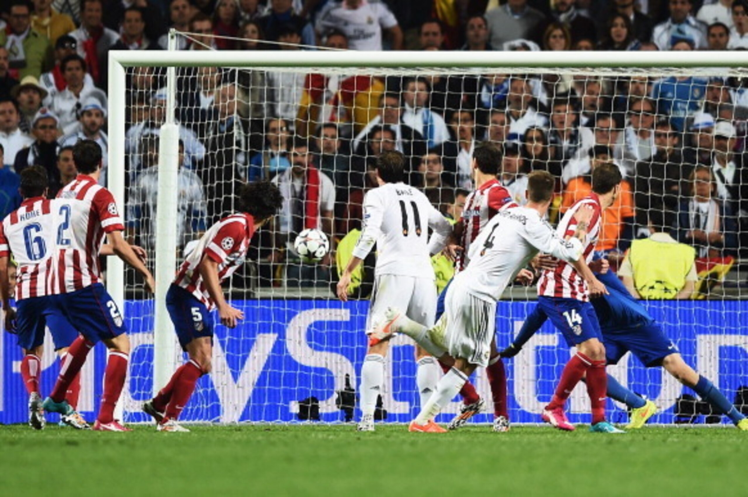 LISBON, PORTUGAL - MAY 24:  Sergio Ramos of Real Madrid (4) scores their second goal during the UEFA Champions League Final between Real Madrid and Atletico de Madrid at Estadio da Luz on May 24, 2014 in Lisbon, Portugal.  (Photo by Laurence Griffiths/Get