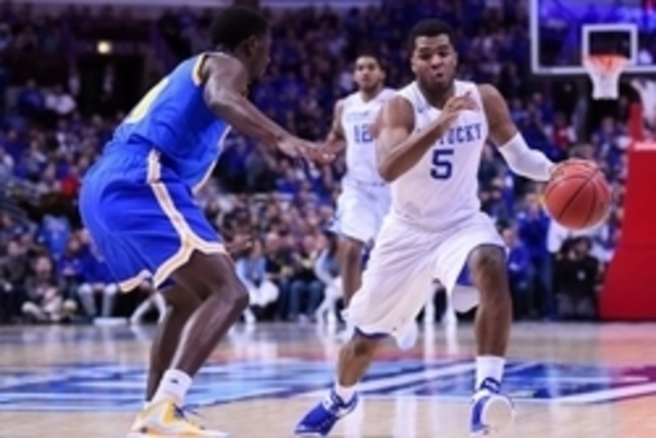 Dec 20, 2014; Chicago, IL, USA; Kentucky Wildcats guard Andrew Harrison (5) dribbles the ball against the UCLA Bruins during the first half at United Center. Mandatory Credit: Mike DiNovo-USA TODAY Sports