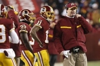 Dec 20, 2014; Landover, MD, USA; Washington Redskins head coach Jay Gruden (R) talks to Redskins wide receiver DeSean Jackson (11) on the sidelines against the Philadelphia Eagles in the fourth quarter at FedEx Field. The Redskins won 27-24. Mandatory Cre