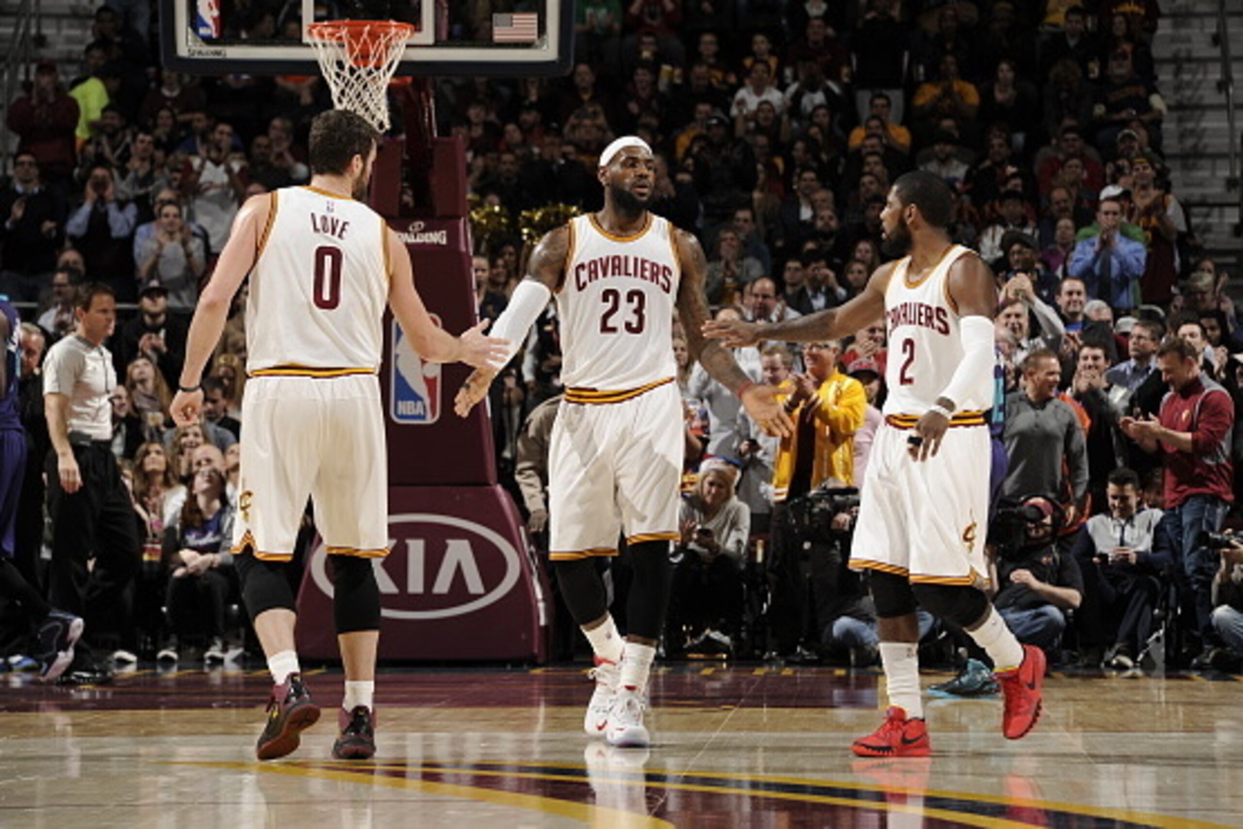 CLEVELAND, OH - DECEMBER 15:  LeBron James #23, Kevin Love #0 and Kyrie Irving #2 of the Cleveland Cavaliers shake hands during the game against the Charlotte Hornets on December 15, 2014 at Quicken Loans Arena in Cleveland, Ohio. NOTE TO USER: User expre