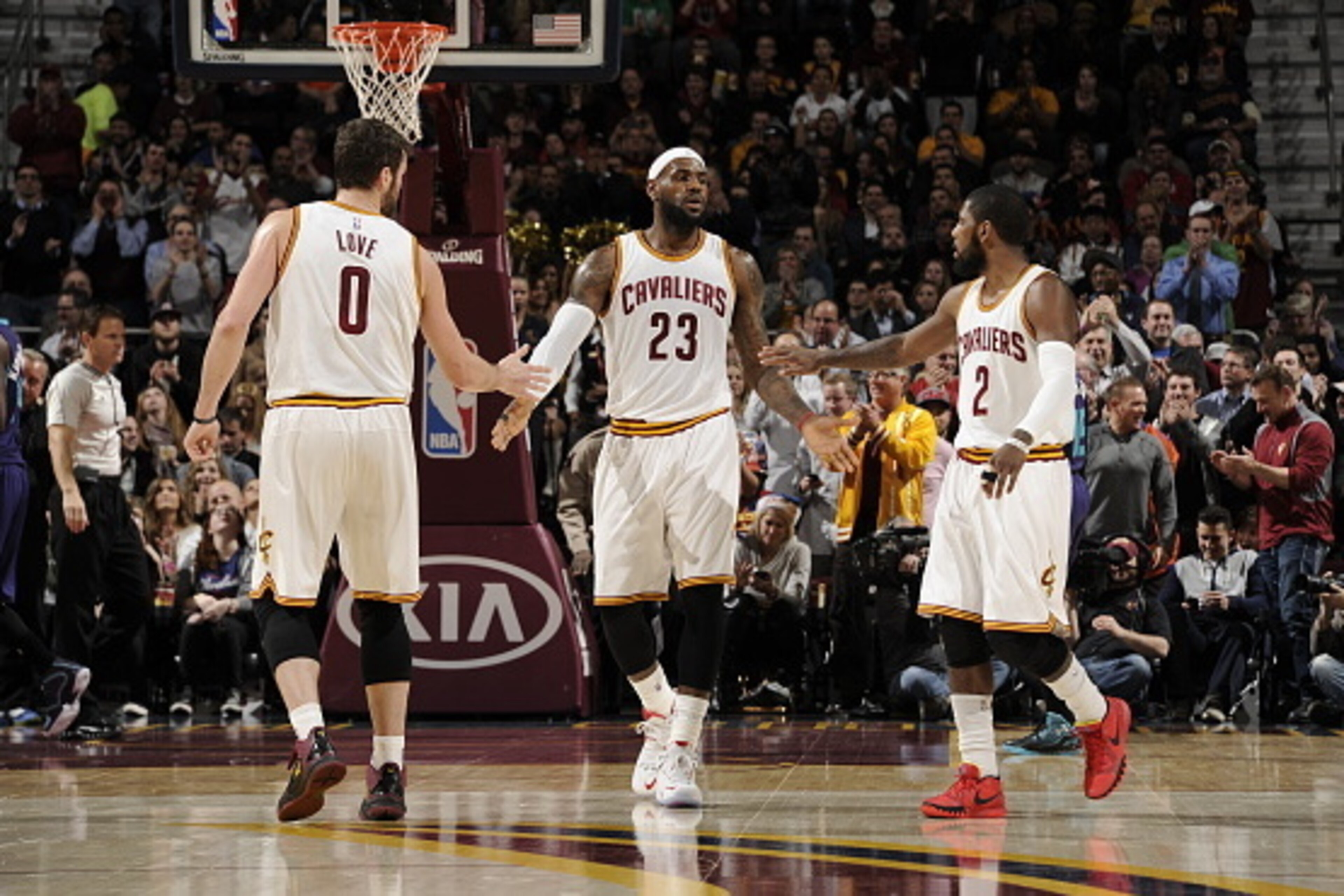 CLEVELAND, OH - DECEMBER 15:  LeBron James #23, Kevin Love #0 and Kyrie Irving #2 of the Cleveland Cavaliers shake hands during the game against the Charlotte Hornets on December 15, 2014 at Quicken Loans Arena in Cleveland, Ohio. NOTE TO USER: User expre
