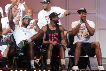 MIAMI, FL - JUNE 24: LeBron James, Dwyane Wade and Chris Bosh of the Miami Heat attend the NBA Championship victory rally at the AmericanAirlines Arena on June 24, 2013 in Miami, Florida. The Miami Heat defeated the San Antonio Spurs in the NBA Finals.  (