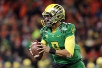 Nov 29, 2014; Corvallis, OR, USA; Oregon Ducks quarterback Marcus Mariota (8) runs the ball against the Oregon State Beavers at Reser Stadium. Mandatory Credit: Scott Olmos-USA TODAY Sports