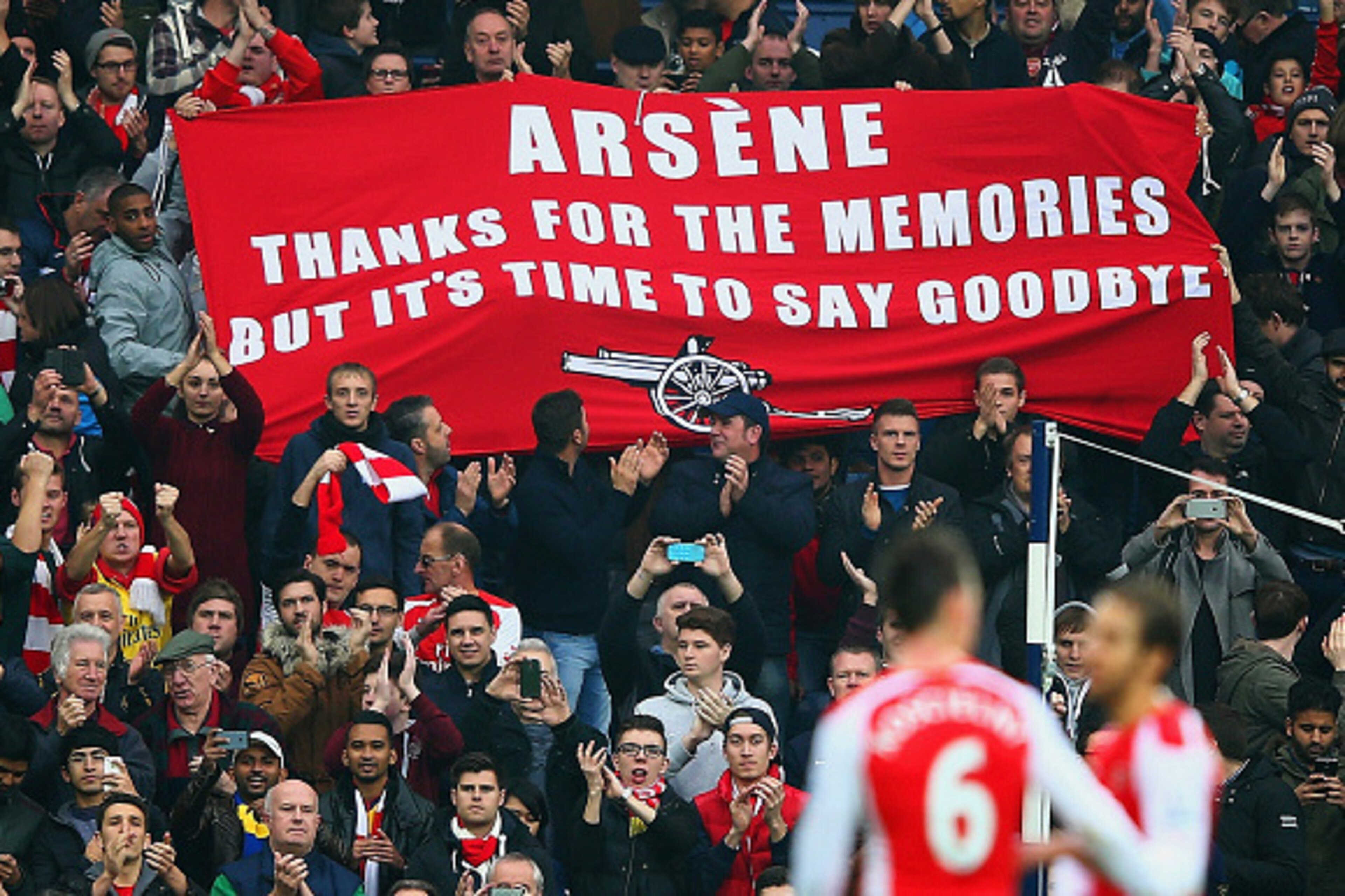 WEST BROMWICH, ENGLAND - NOVEMBER 29:   (EDITORS NOTE: This is a retransmission of image #459708260 with an alternative crop)   Arsenal fans hold up a banner for Arsene Wenger, manager of Arsenal during the Barclays Premier League match between West Bromw