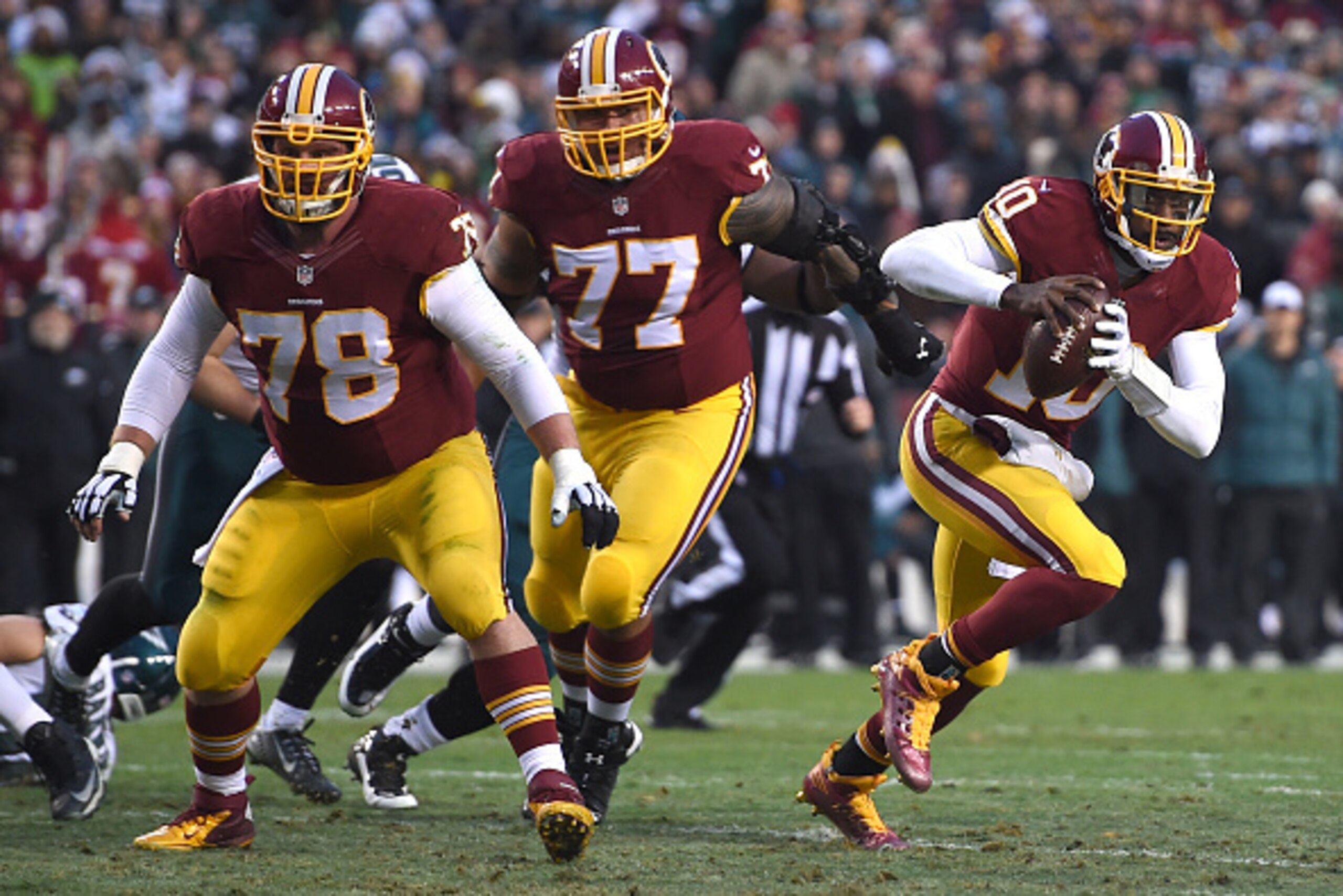 LANDOVER, MD - DECEMBER 20: Quarterback Robert Griffin III #10 of the Washington Redskins rushes in the first half against the Philadelphia Eagles at FedExField on December 20, 2014 in Landover, Maryland. The Washington Redskins won, 27-24. (Photo by Patr