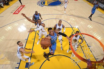OAKLAND, CA - DECEMBER 18: Russell Westbrook #0 of the Oklahoma City Thunder goes up for a shot against the Golden State Warriors on December 18, 2014 at Oracle Arena in Oakland, California. NOTE TO USER: User expressly acknowledges and agrees that, by do