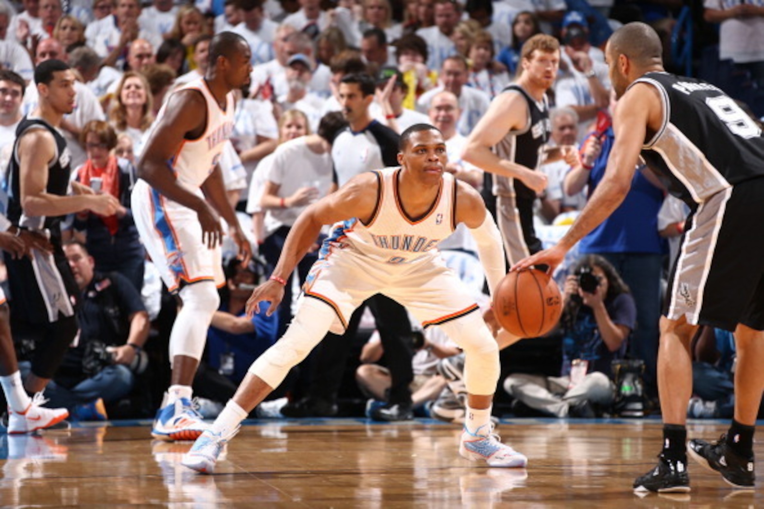 OKLAHOMA CITY, OK - May 31: Russell Westbrook #0 of the Oklahoma City Thunder plays tight defense against the San Antonio Spurs in Game 6 of the Western Conference Finals during the 2014 NBA Playoffs at the Chesapeake Arena on May 31, 2014 in Oklahoma Cit
