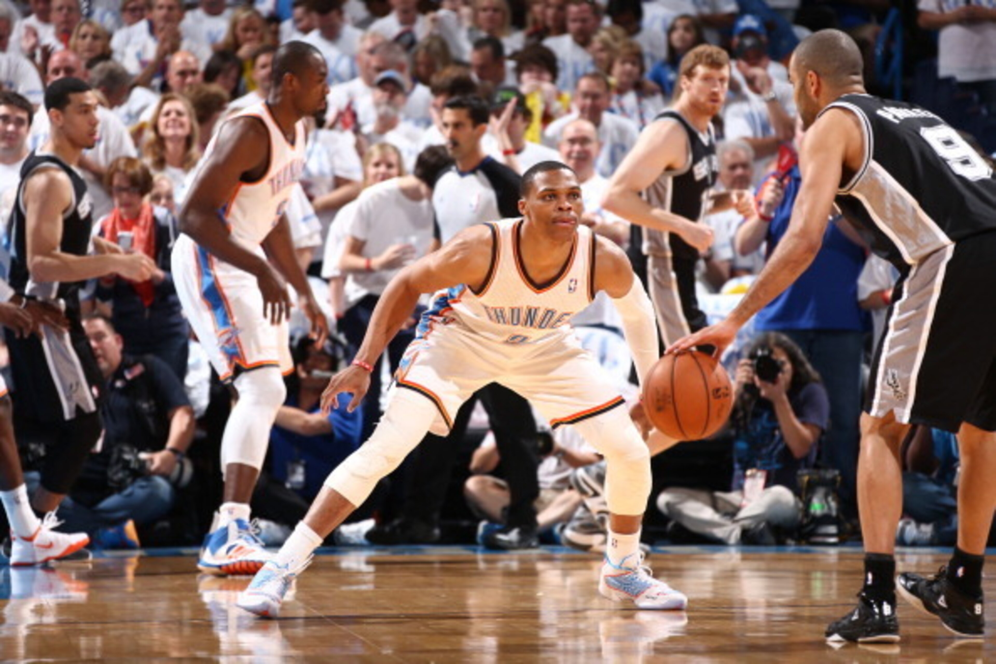 OKLAHOMA CITY, OK - May 31: Russell Westbrook #0 of the Oklahoma City Thunder plays tight defense against the San Antonio Spurs in Game 6 of the Western Conference Finals during the 2014 NBA Playoffs at the Chesapeake Arena on May 31, 2014 in Oklahoma Cit OKLAHOMA CITY, OK - May 31: Russell Westbrook #0 of the Oklahoma City Thunder plays tight defense against the San Antonio Spurs in Game 6 of the Western Conference Finals during the 2014 NBA Playoffs at the Chesapeake Arena on May 31, 2014 in Oklahoma Cit