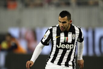 CAGLIARI, ITALY - DECEMBER 18:  Carlos Tevez of Juventus in action during the Serie A match betweeen Cagliari Calcio and Juventus FC at Stadio Sant'Elia on December 18, 2014 in Cagliari, Italy.  (Photo by Enrico Locci/Getty Images)