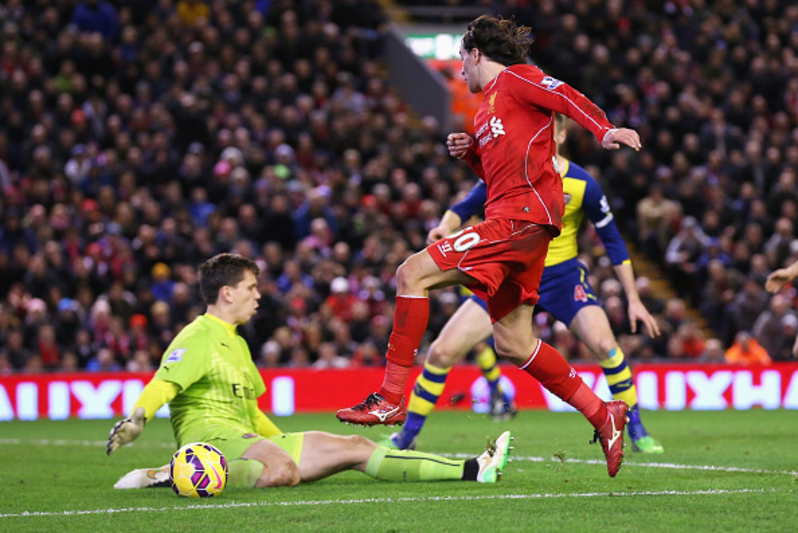 LIVERPOOL, ENGLAND - DECEMBER 21:  Lazar Markovic of Liverpool has his shot saved by Wojciech Szczesny of Arsenal during the Barclays Premier League match between Liverpool and Arsenal at Anfield on December 21, 2014 in Liverpool, England.  (Photo by Alex