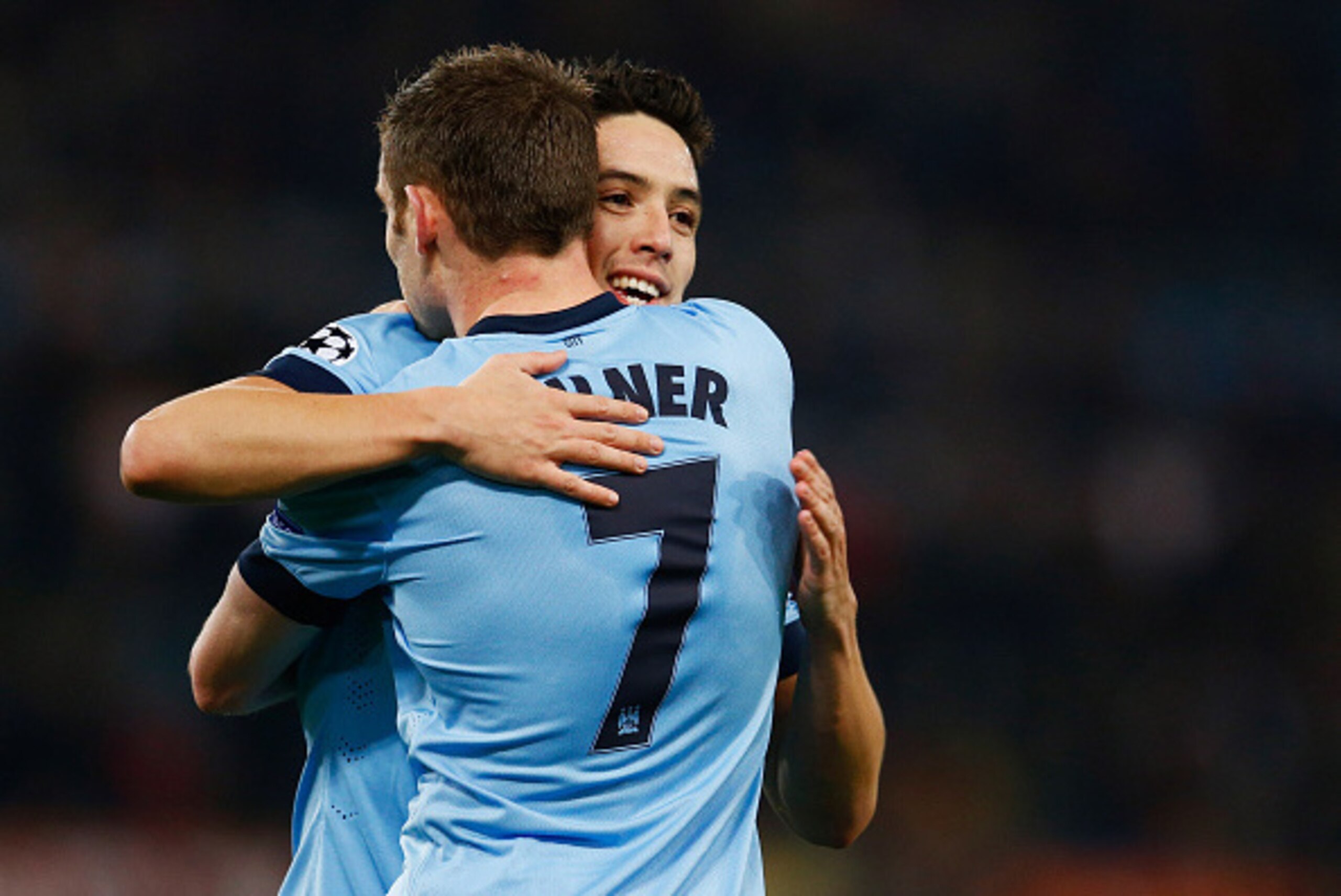 ROME, ITALY - DECEMBER 10:  Samir Nasri of Manchester City celebrates with James Milner (7) as he scores their first goal during the UEFA Champions League Group E match between AS Roma and Manchester City FC at Stadio Olimpico on December 10, 2014 in Rome